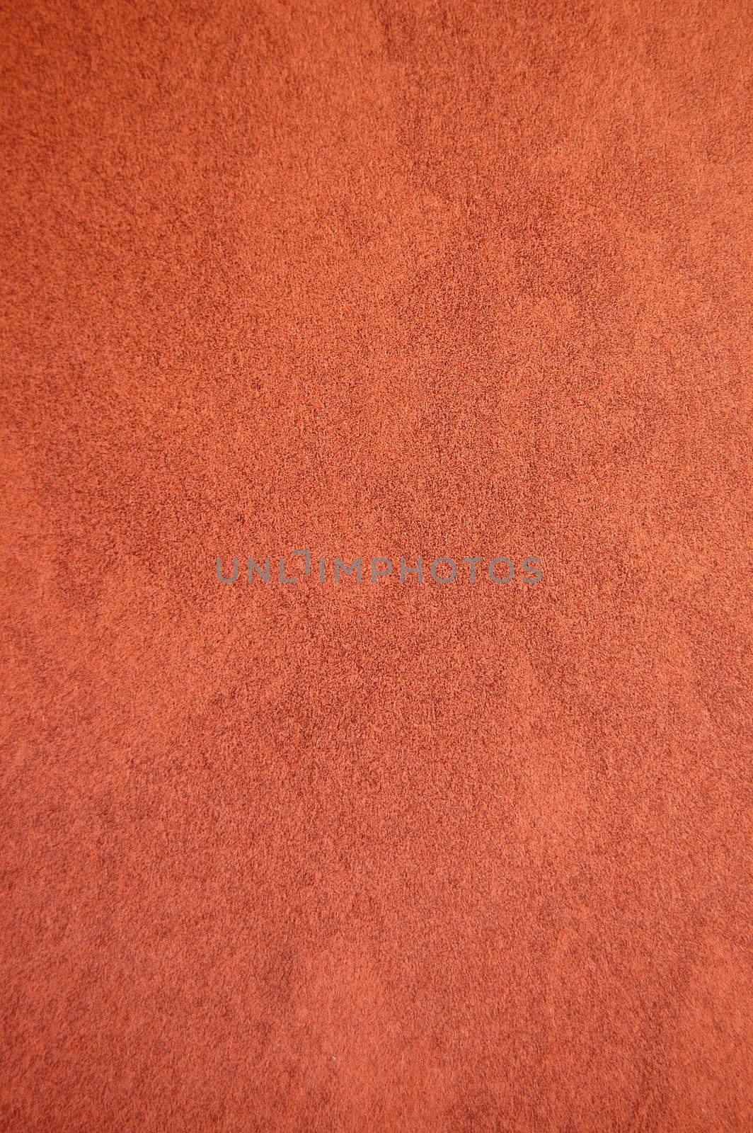 Dark brown recycled speckled cardboard paper detail. Background texture.