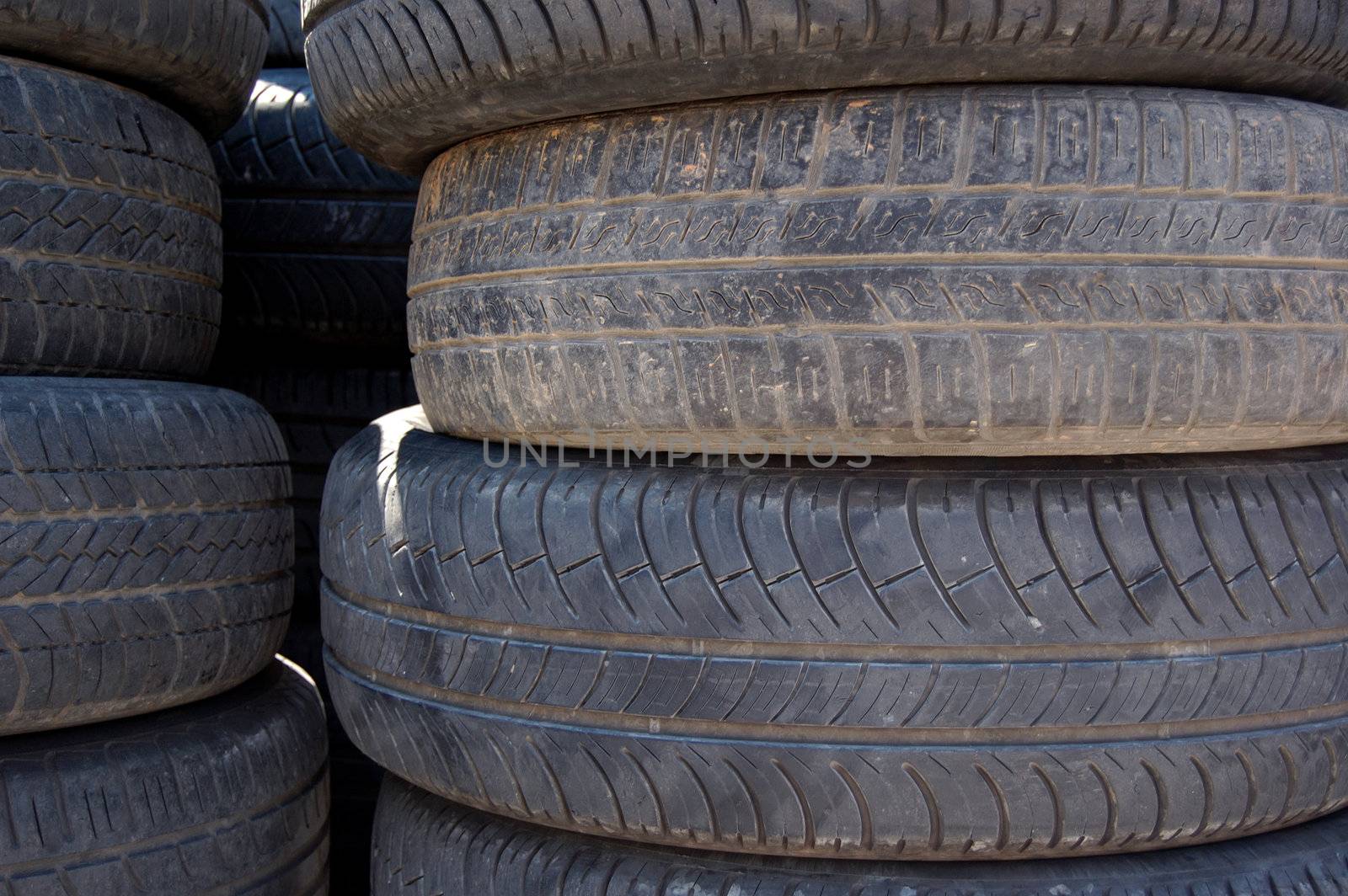 A pile of rubber car tires. Abstract background pattern.