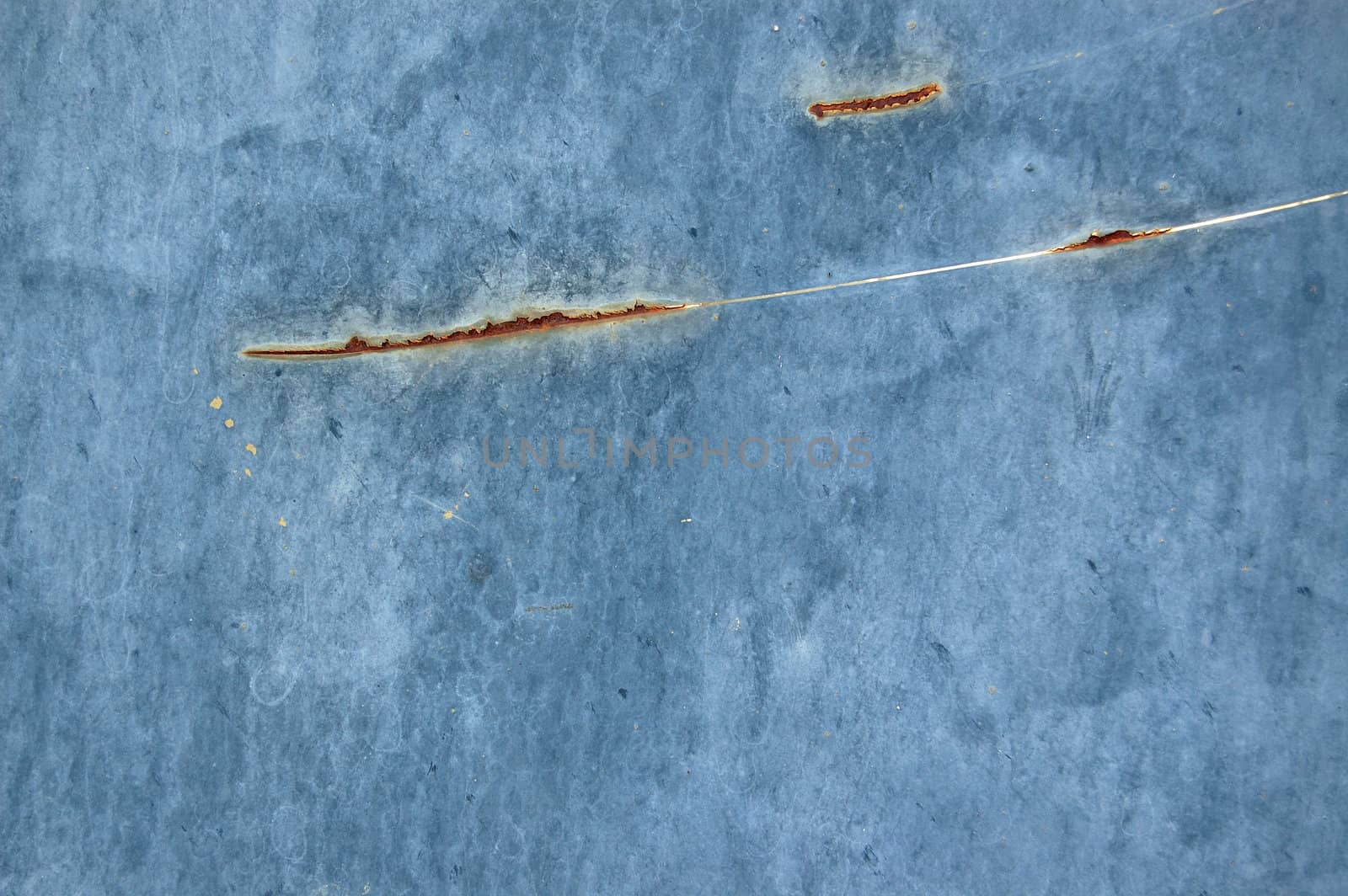 Rusty metal with blue scratched paint. Abstract background texture.