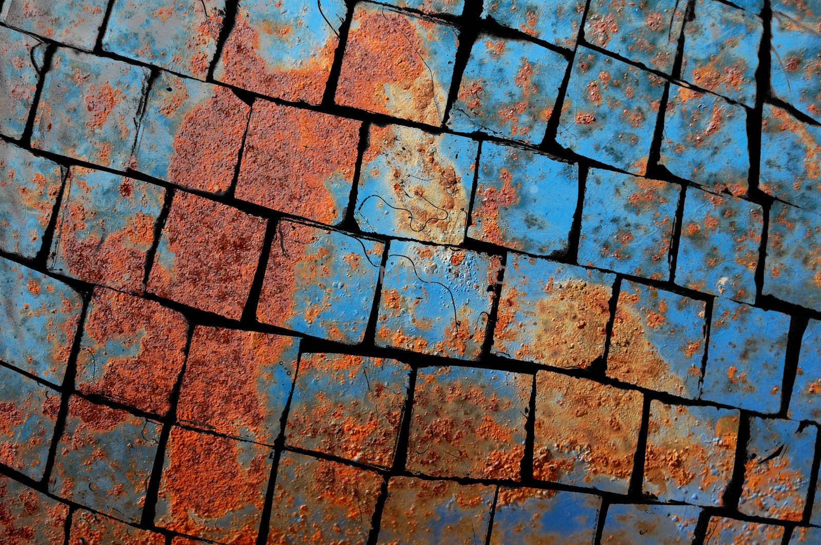 Rusty metal barrel texture broken in square pieces.