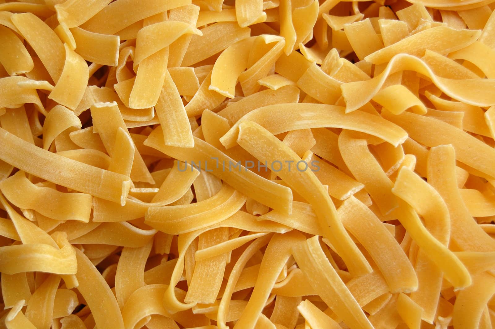 Tagliatelle pasta detail. Italian food background.