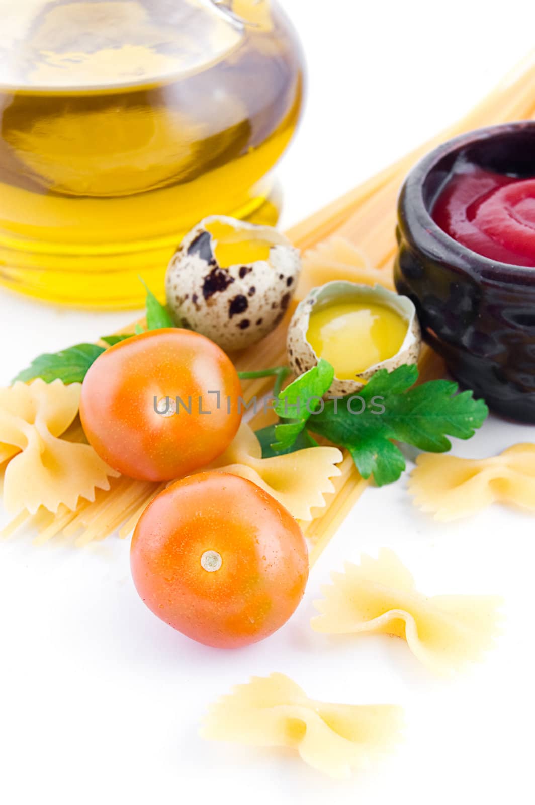 Pasta ingredients with cherry tomato, ketchup, greens and eggs