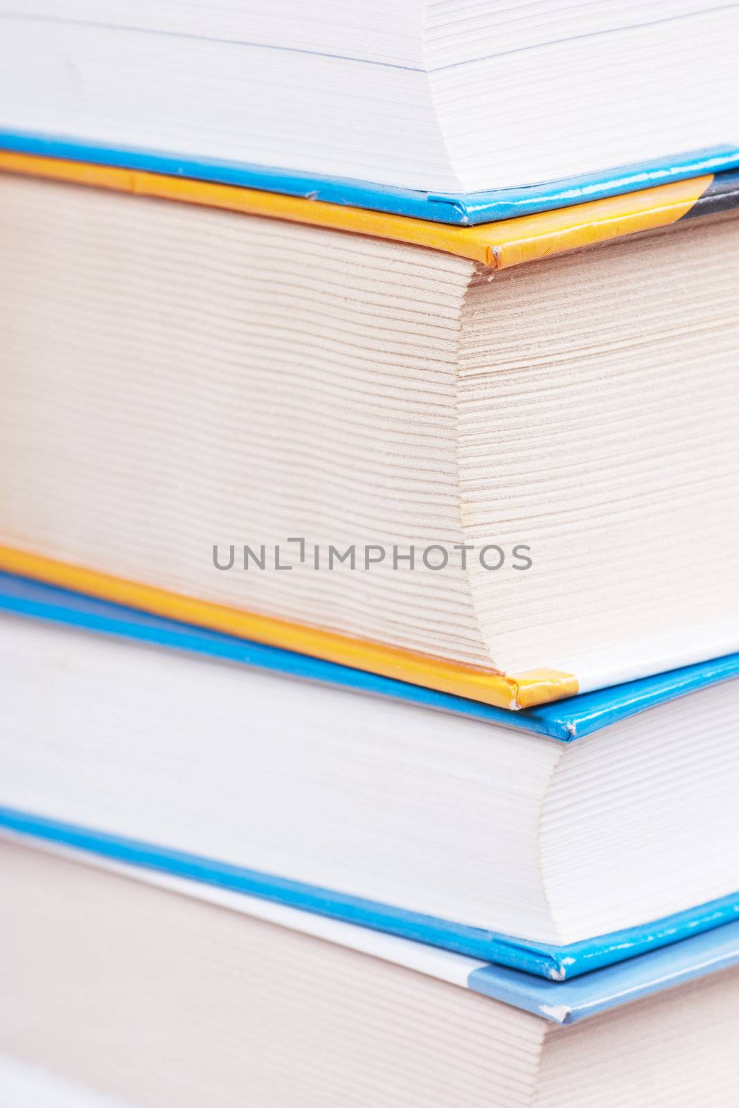 A stack of books. Closeup view.