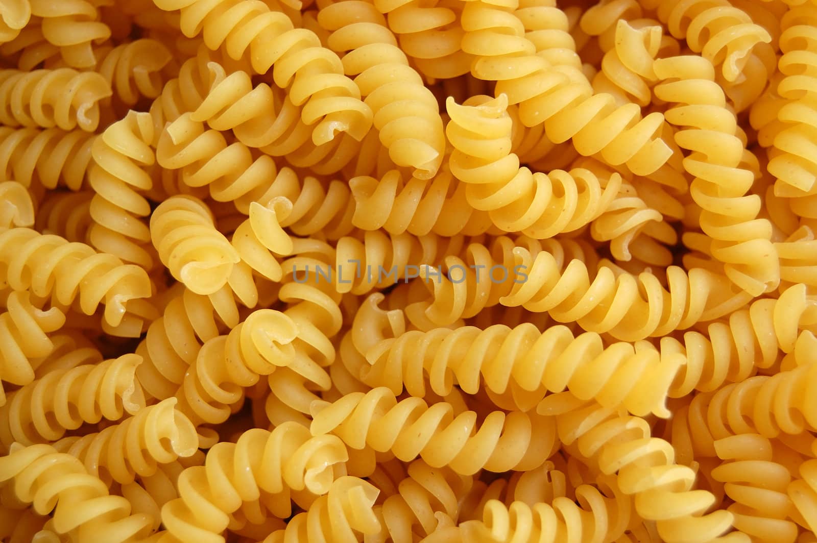 Eliche twirls pasta detail. Italian food background.