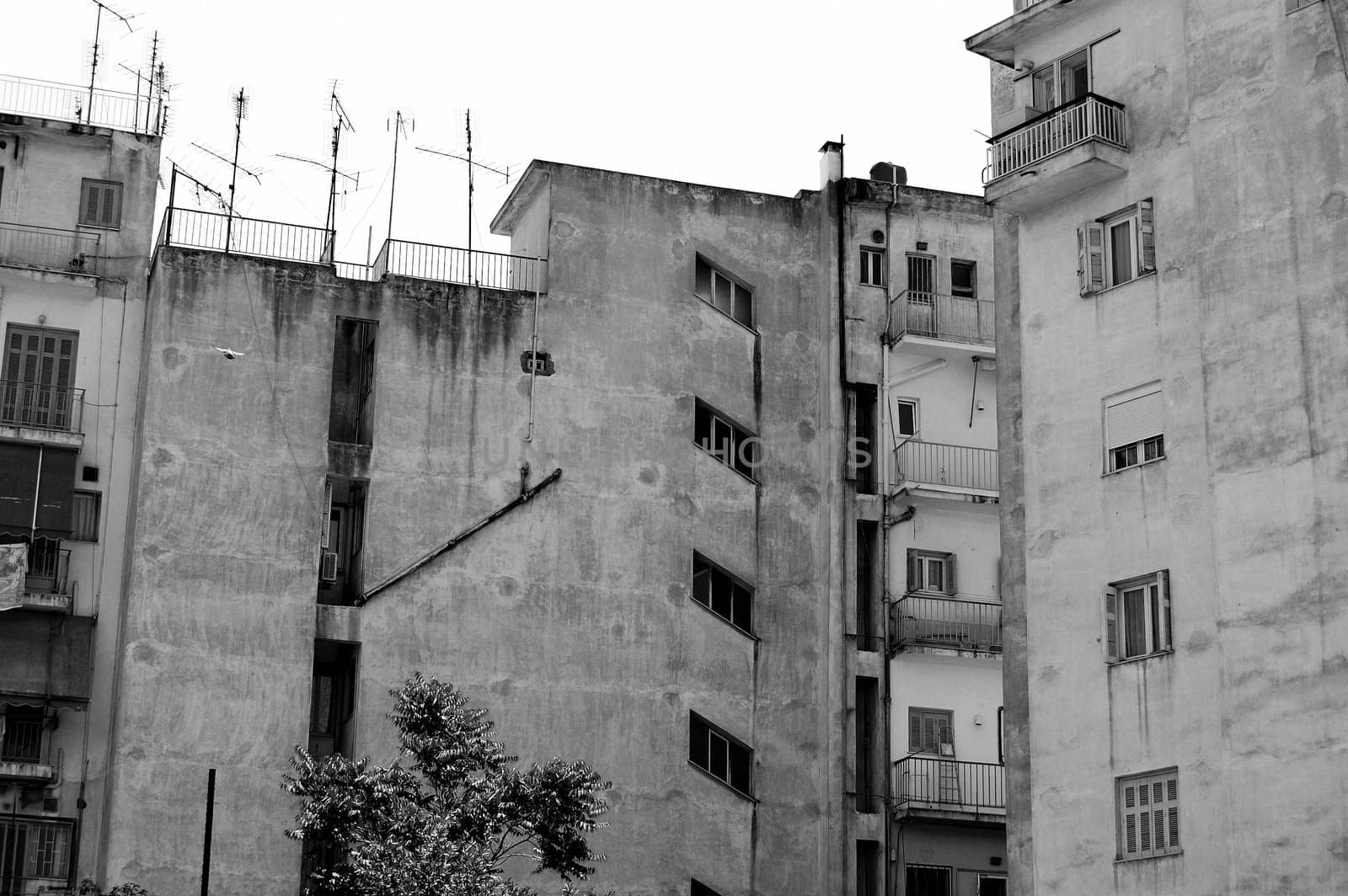 Inner city grunge apartment building. Urban background.