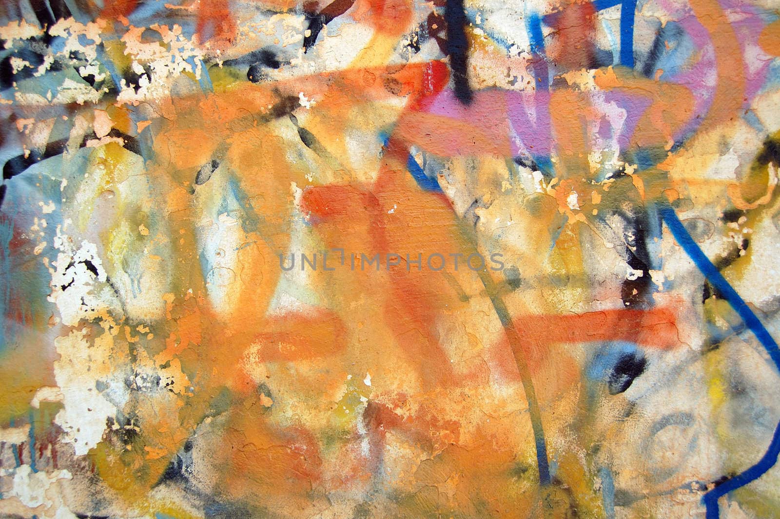 Detail of a weathered wall covered with graffiti.