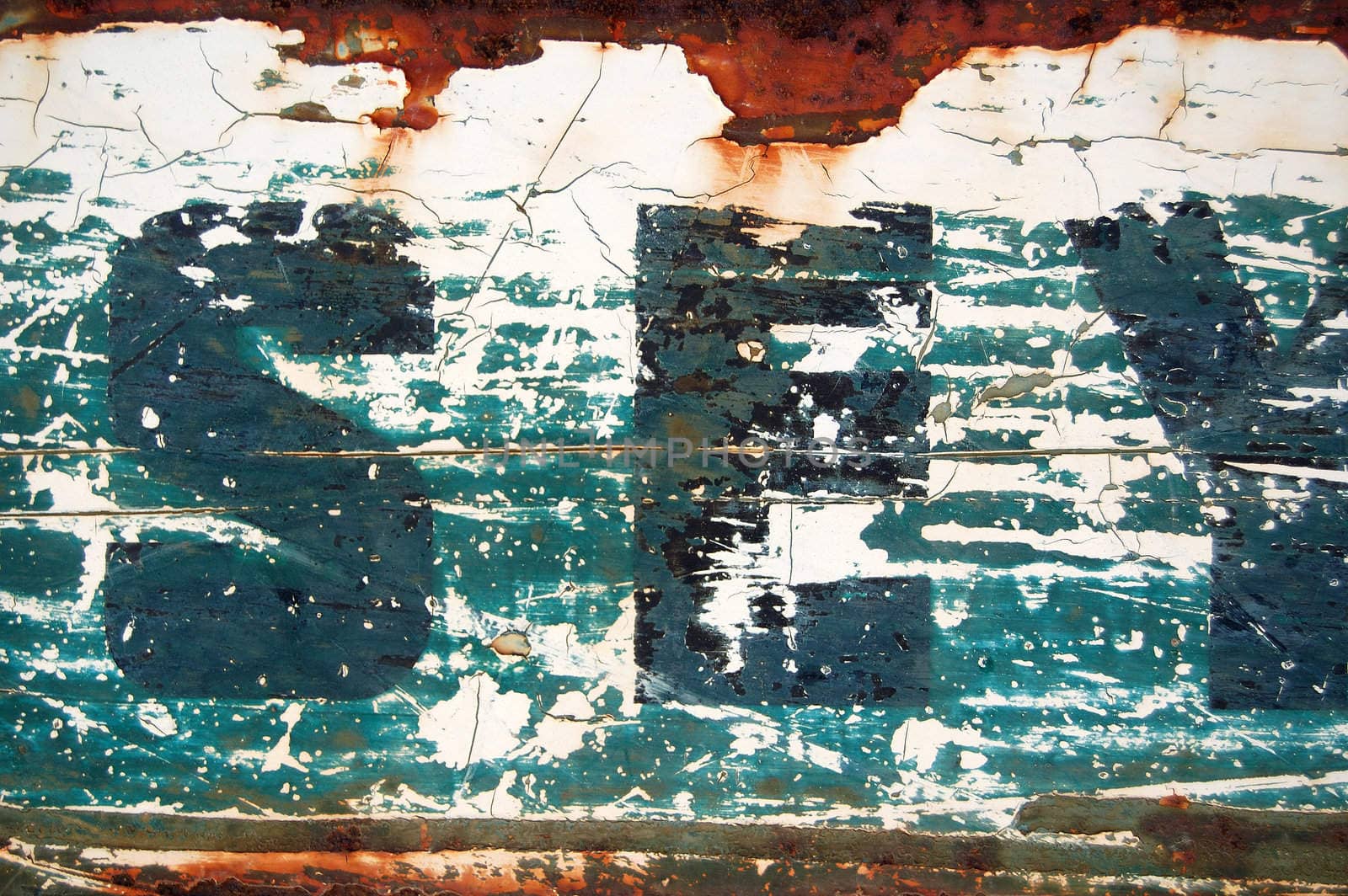 Type stencil on rusty metal surface. Abstract background texture.
