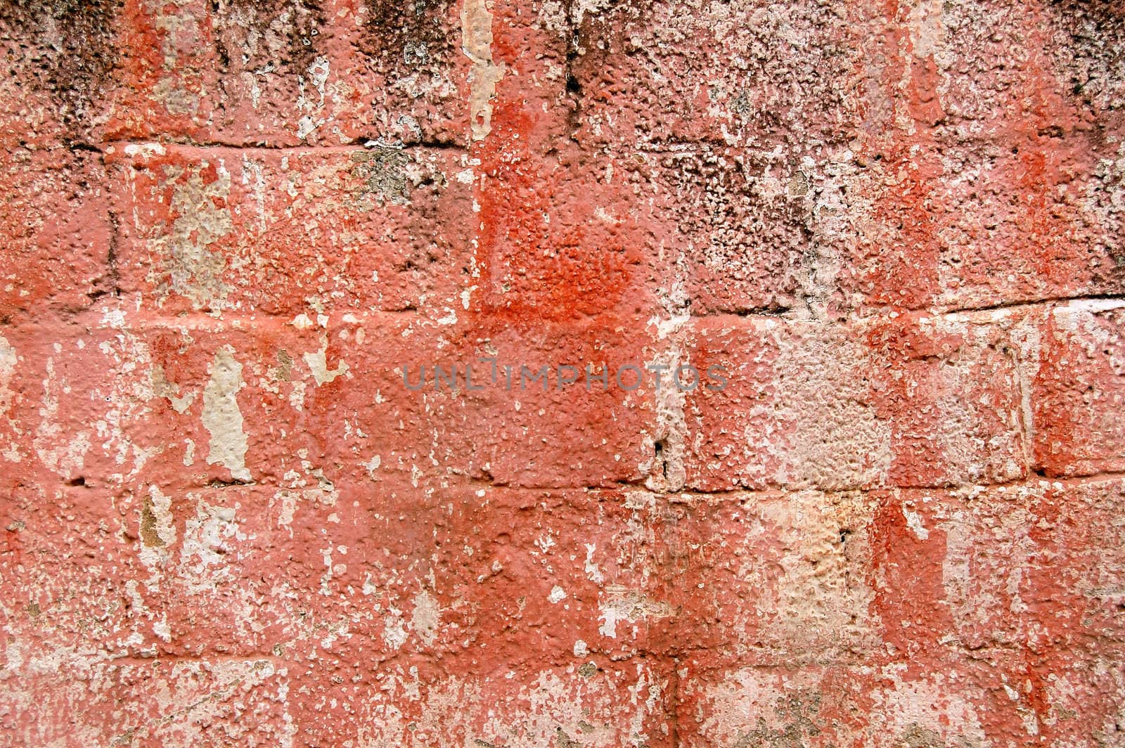 Cinder block brick wall texture. Grungy peeling paint background pattern.