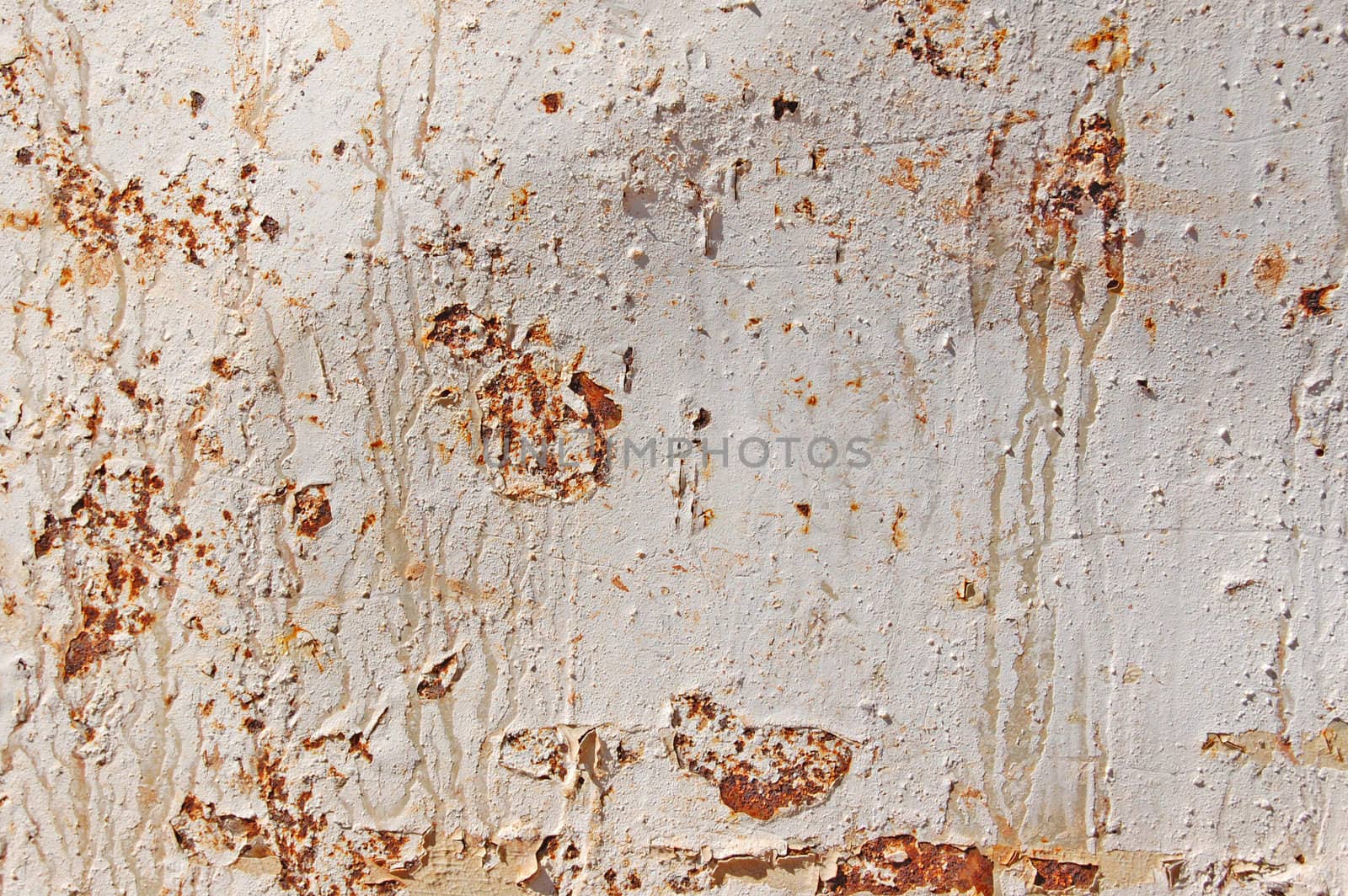 Rusty metal texture background. Peeling white paint.