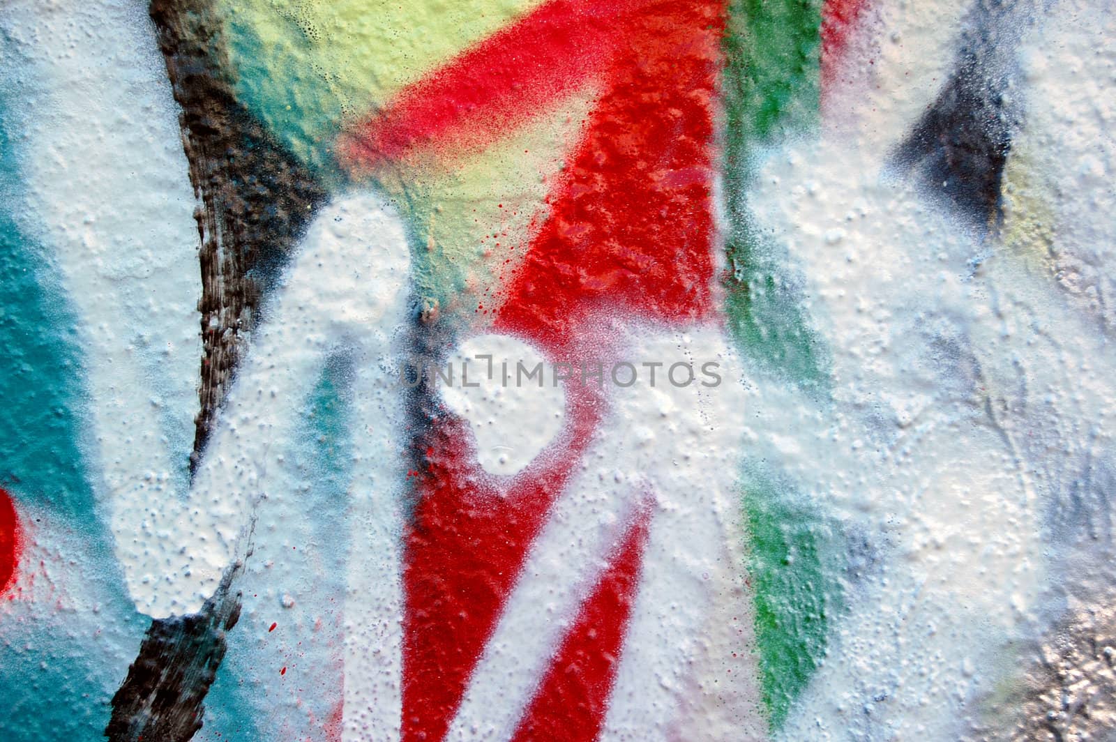 Detail of a wall covered with graffiti.