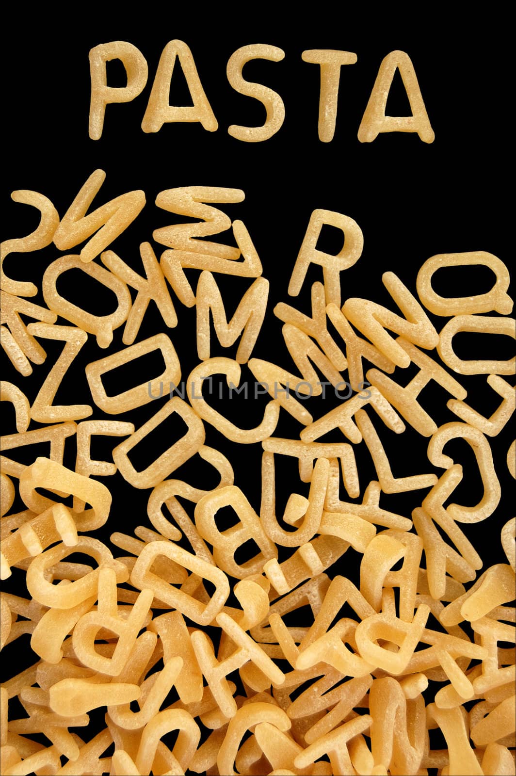Spelling of the word pasta with alphabet soup letters. Kids food background.
