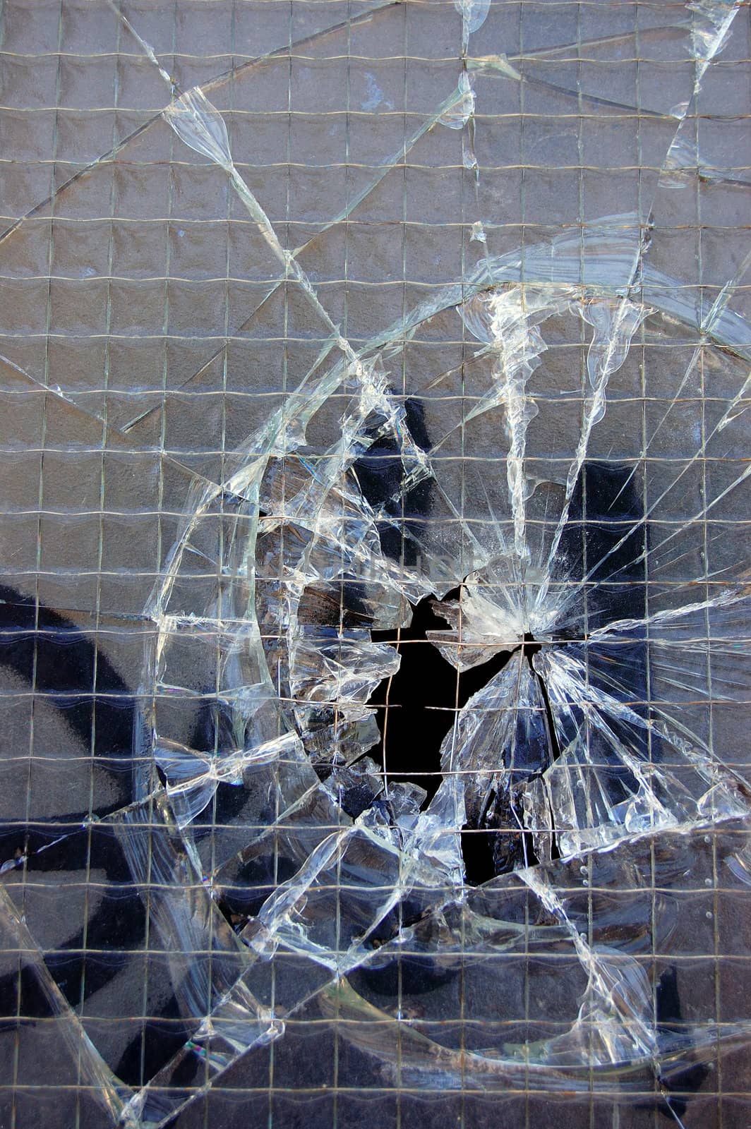 Broken glass surface texture detail. Abstract background pattern.