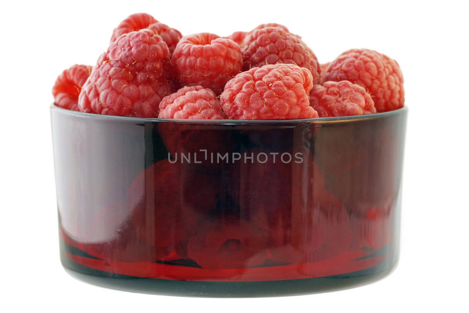 Rasperries in glass red bowl by Mirage3