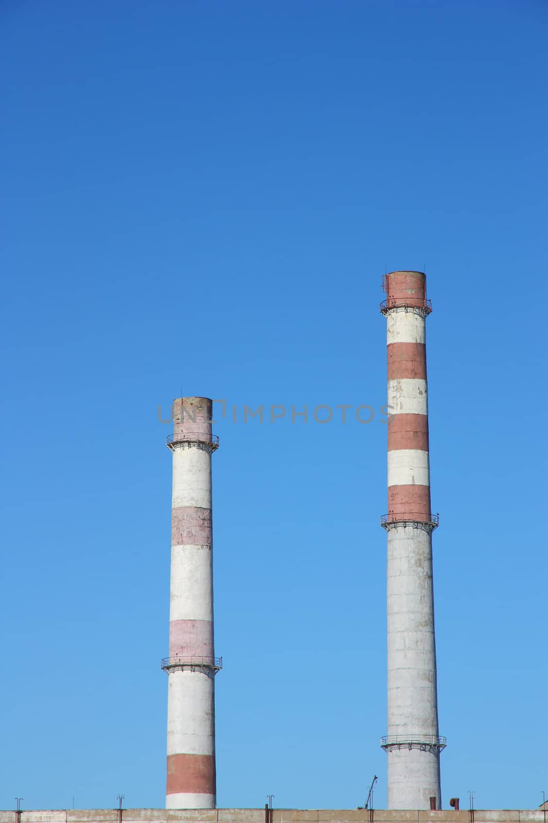 chimneys large plant against the blue sky