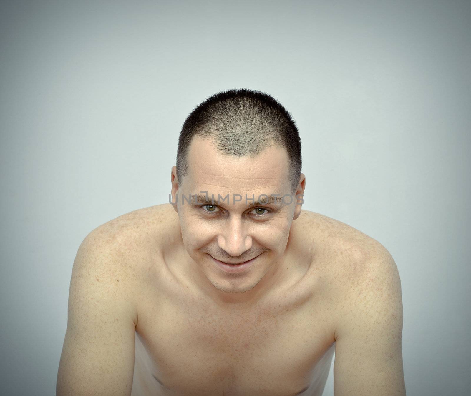 Young man looking at camera and smiling