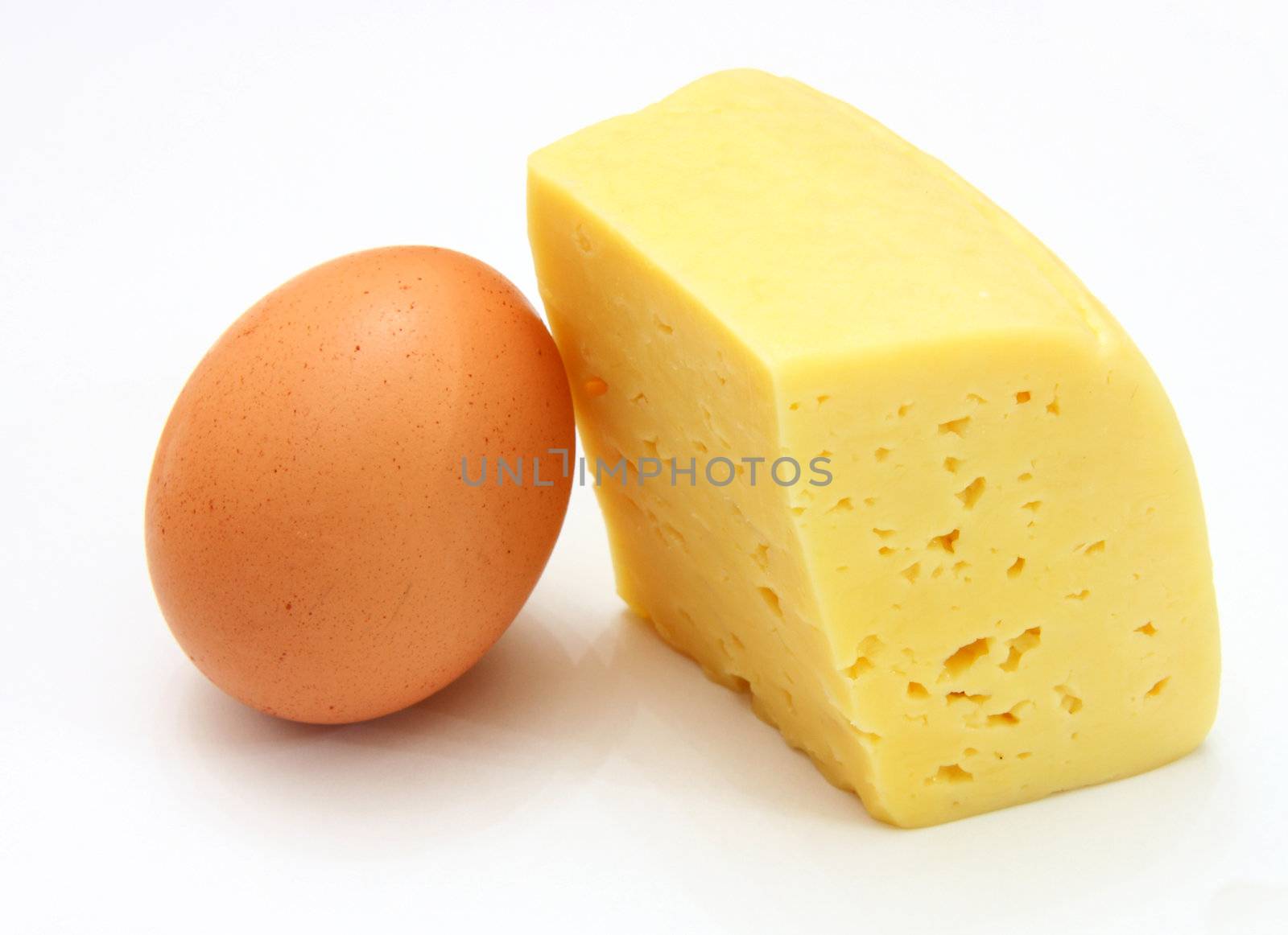 cheese and eggs, isolated on white.