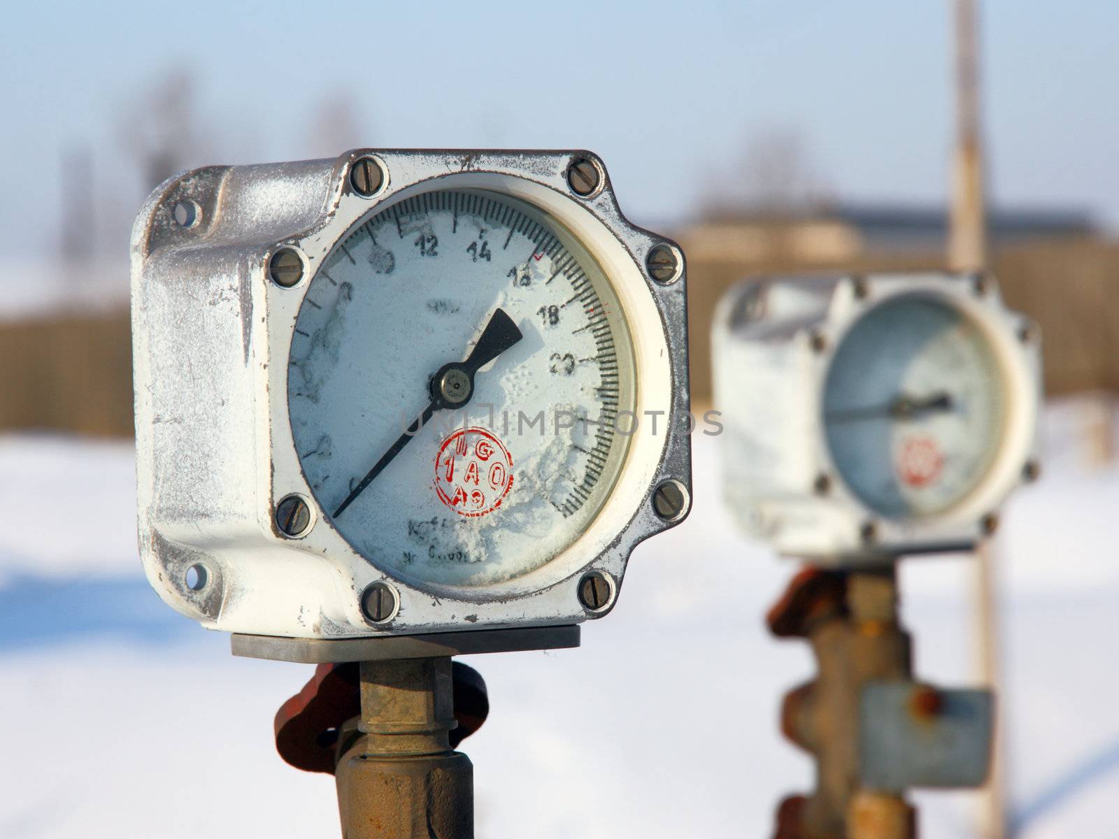 Old gas manometer in the winter in hoarfrost