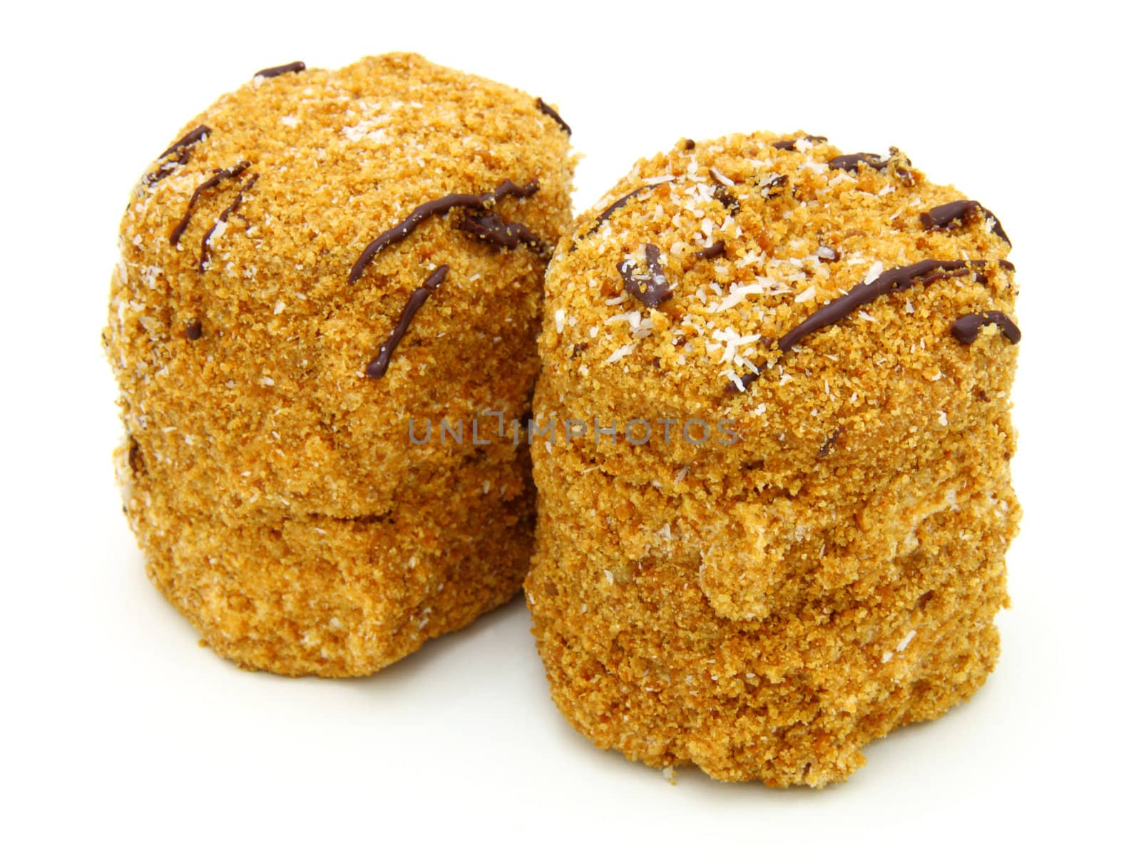 Honey cake with chocolate on a white background