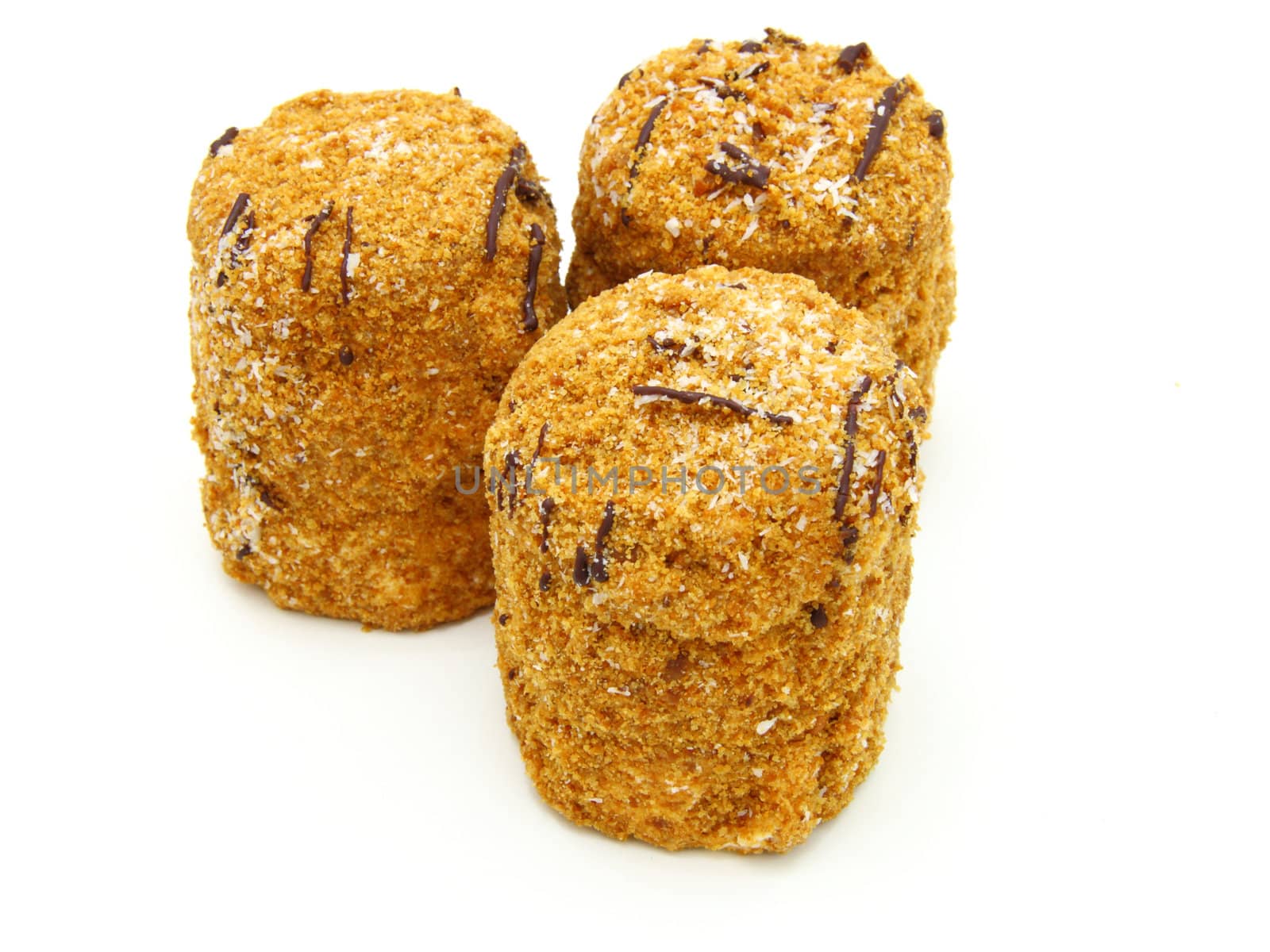 Honey cake with chocolate on a white background