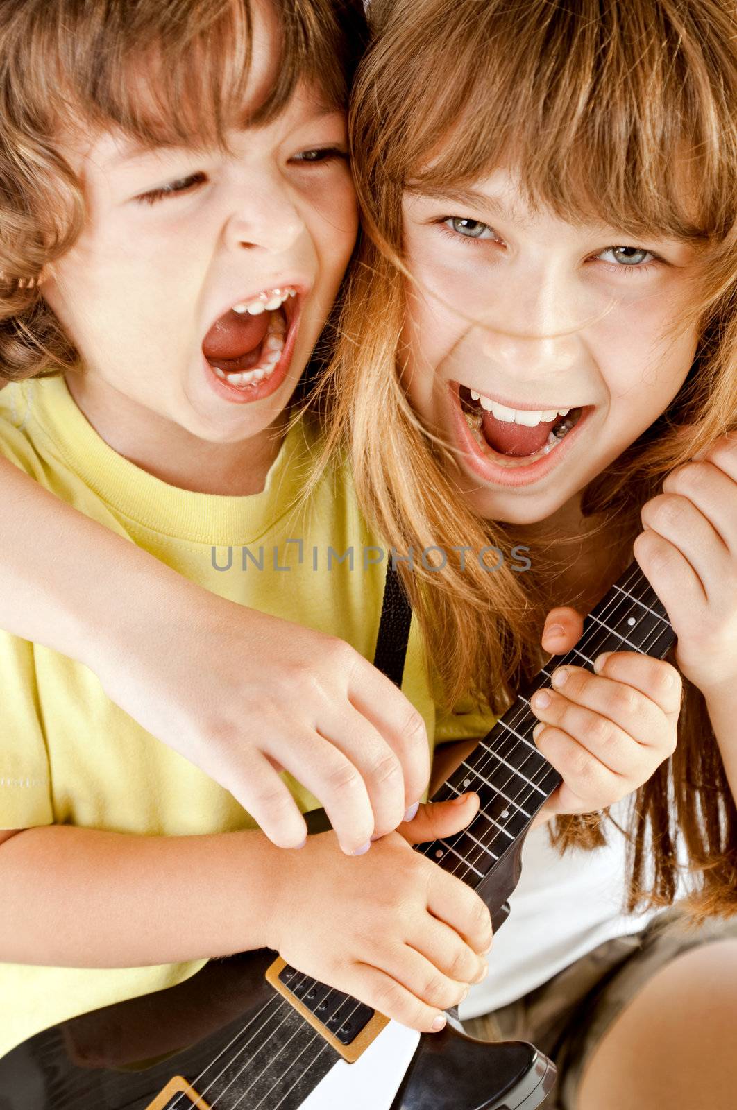 kids playing guitar singing by vilevi