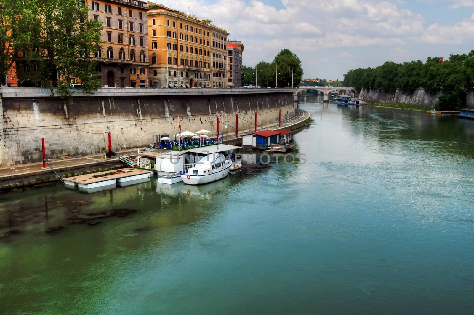 Houseboats and boats on the Tiber in Rome