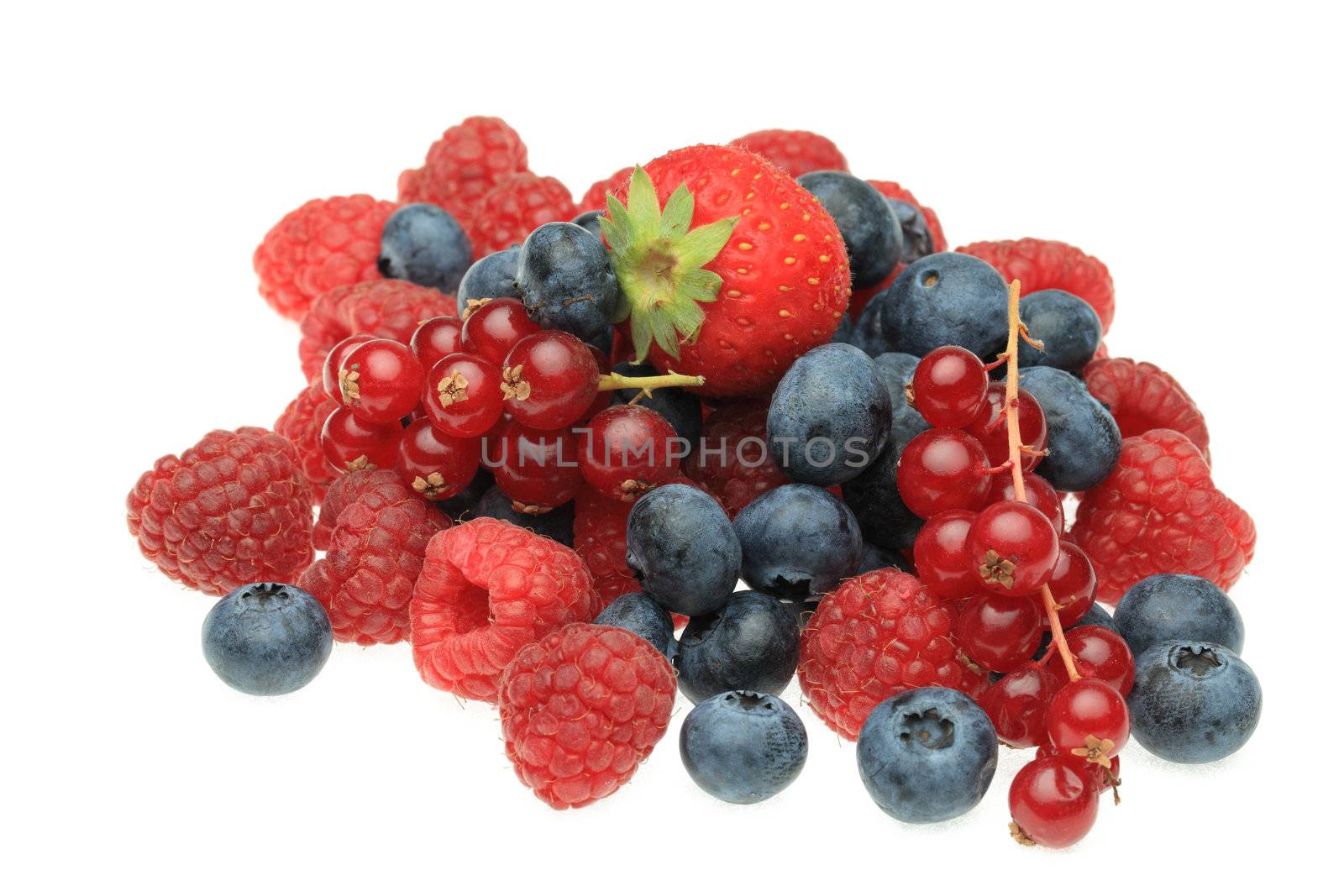 Image of a heap of various berry fruits photographed in a studio against a white background.
