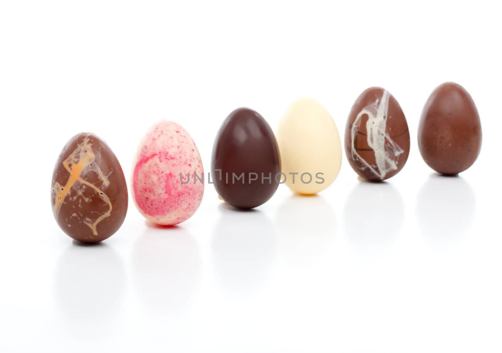 Luxury selection of six decadent easter eggs angled on a white background.  