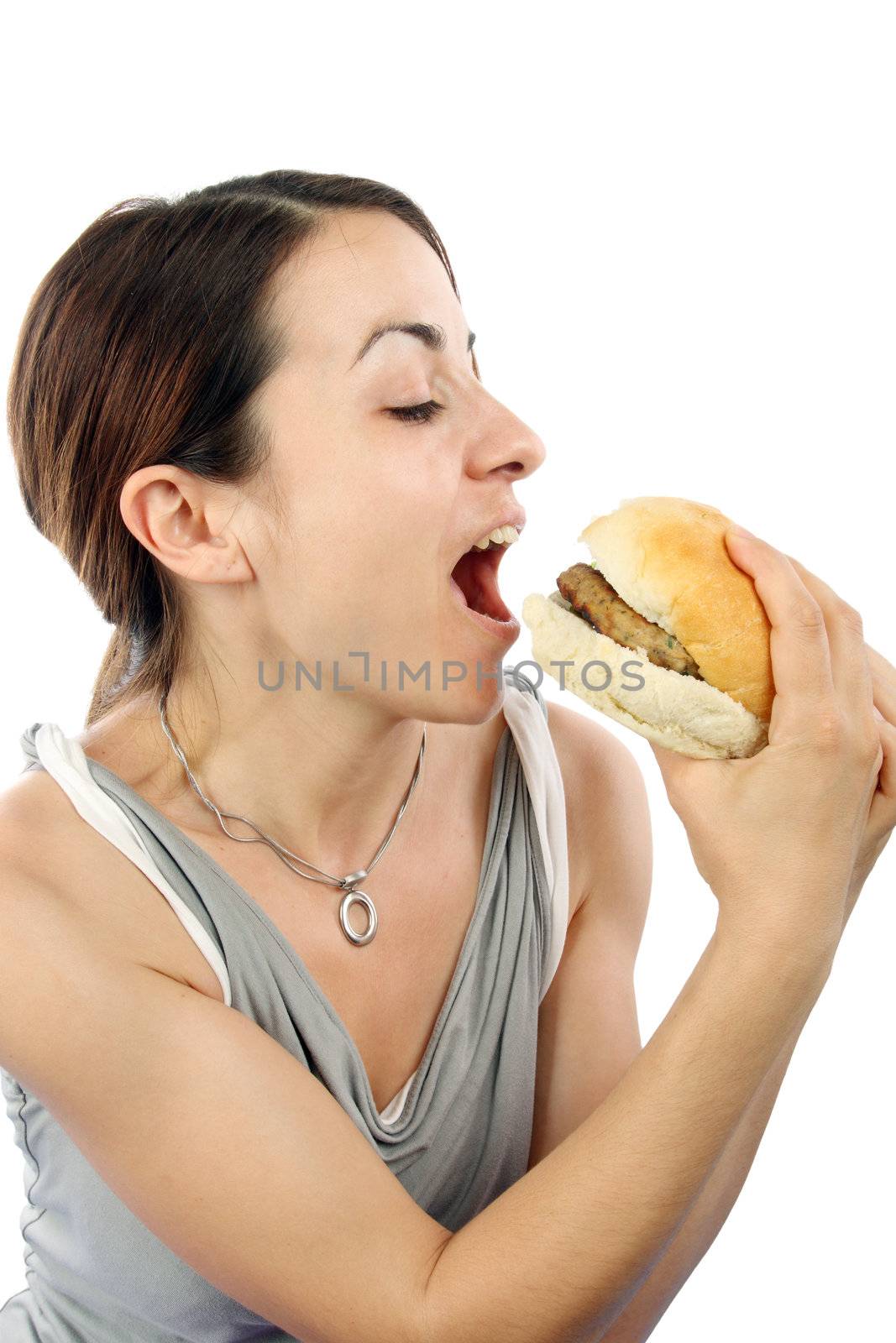 woman eating hamburger by alexkosev