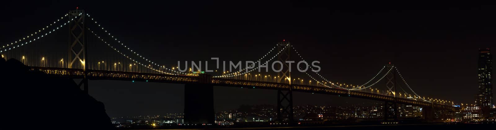 Oakland Bay Bridge Over San Francisco Bay in California at Night Panorama