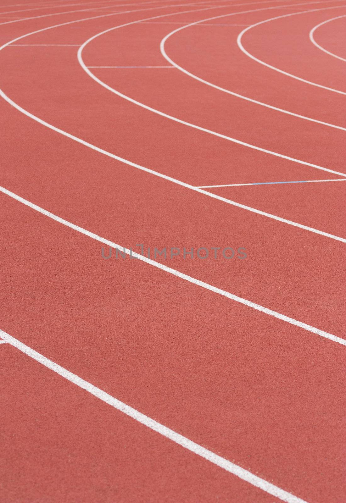 Athletics track with its lane, white lines and turn