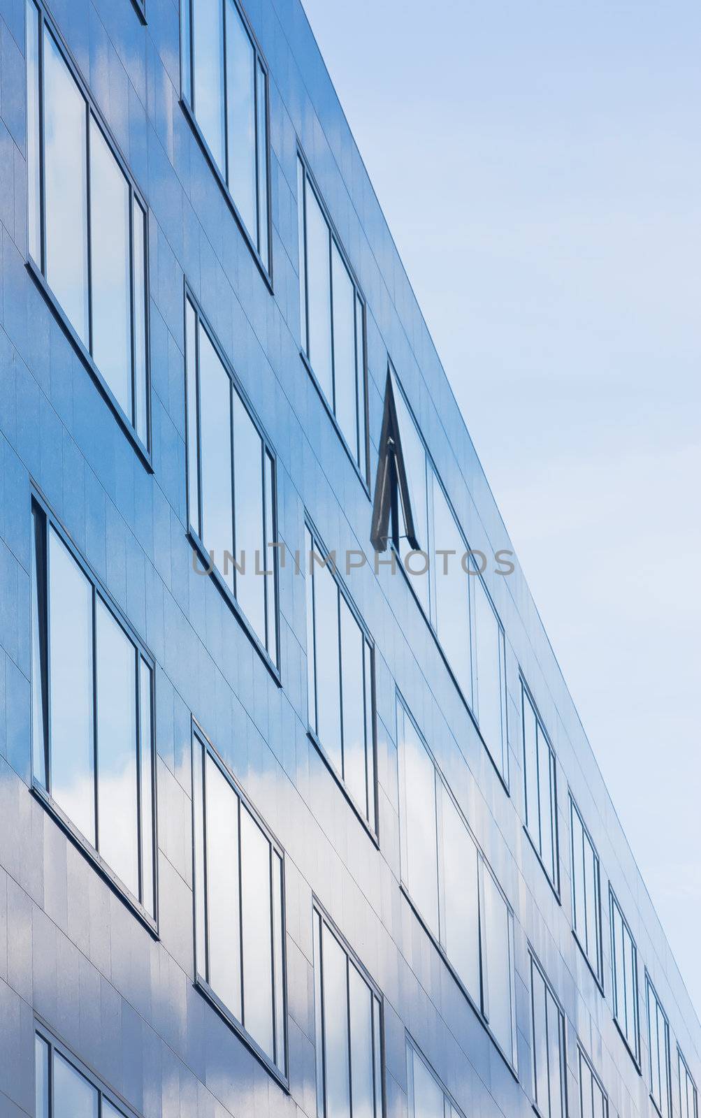 Facade of office building in blue atmosphere