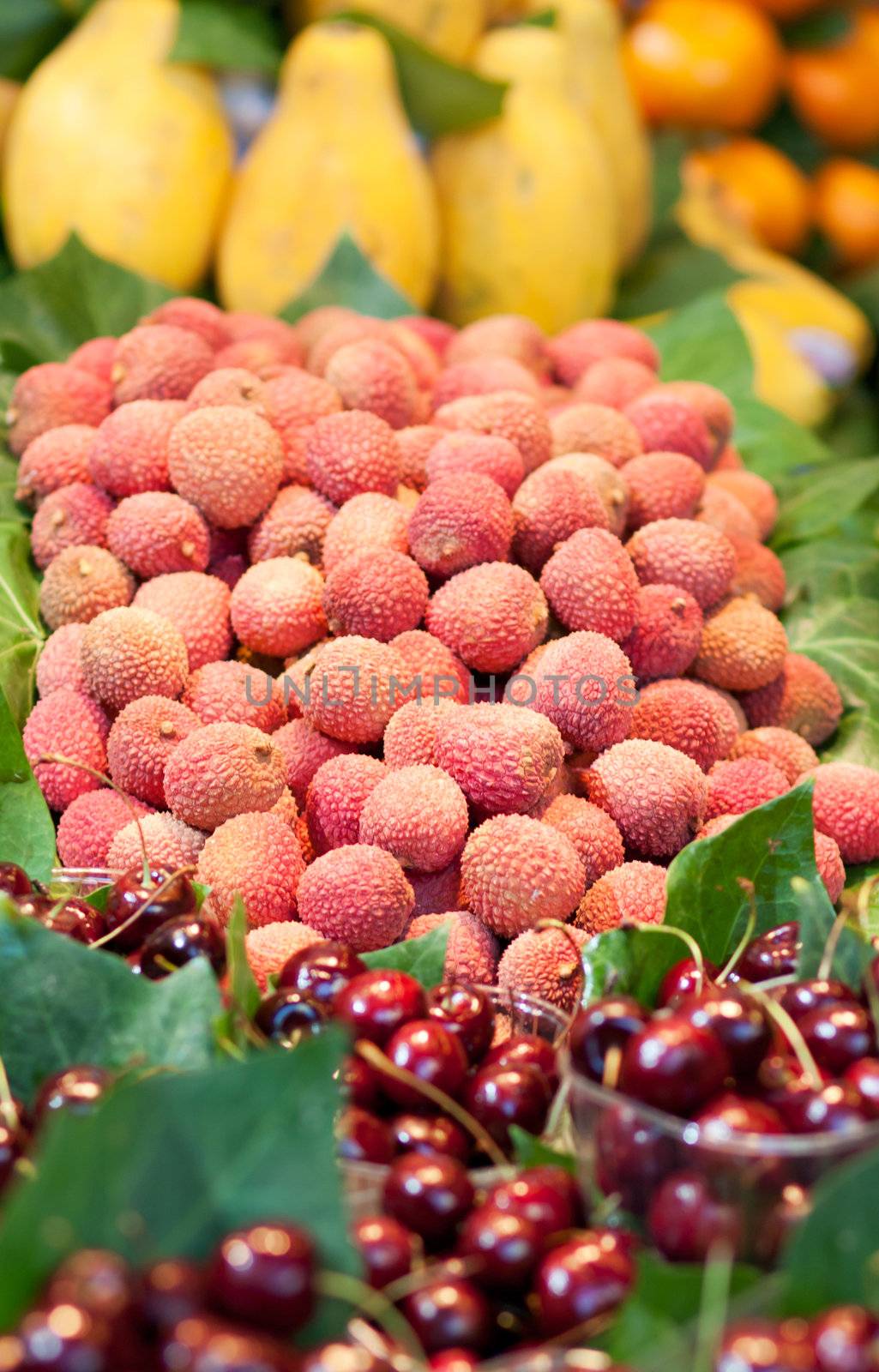 Lychees and other fruits on a market stall