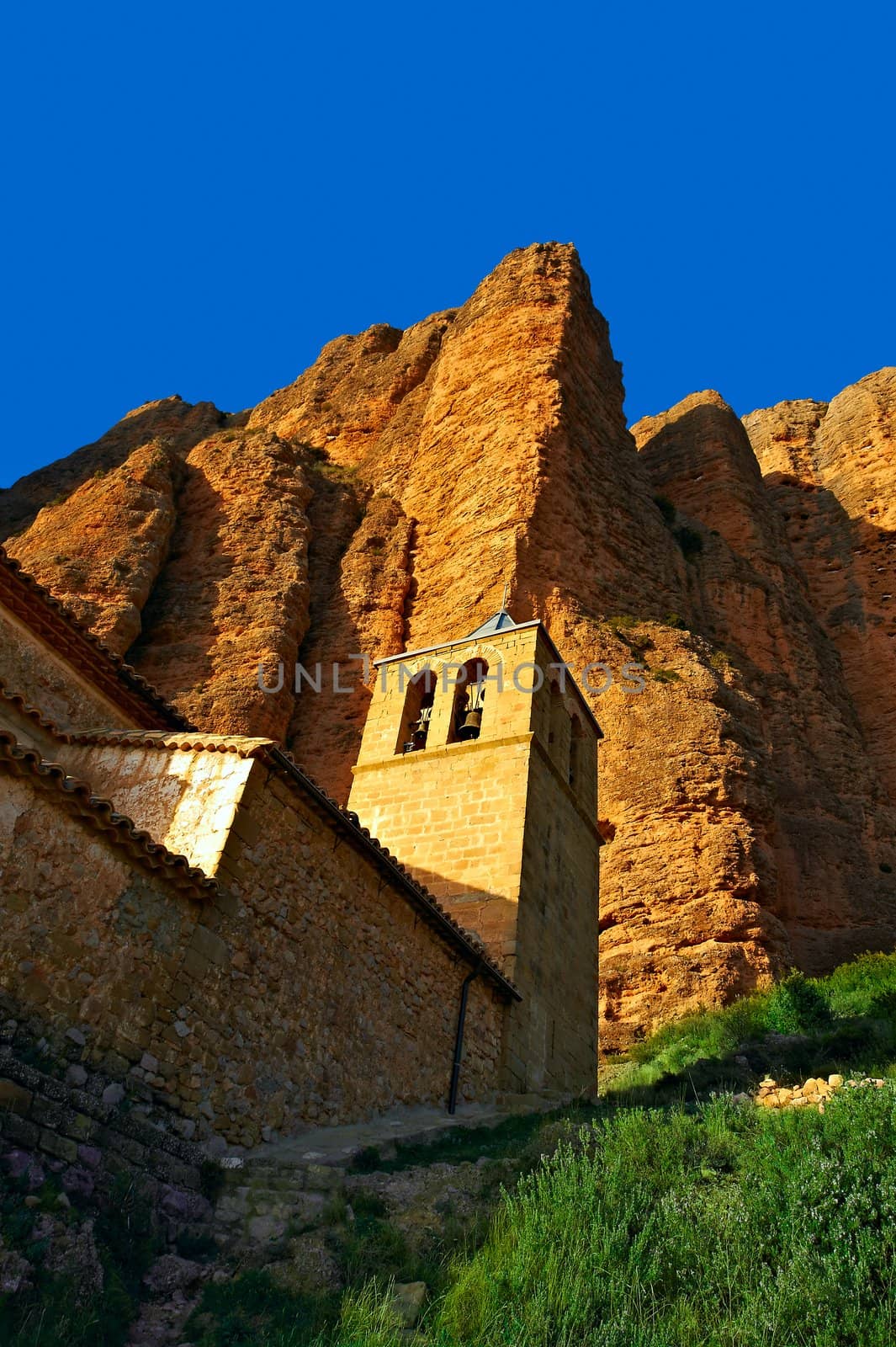 Spanish Medieval Church at the Foot of the Rocks in the Pyrenees