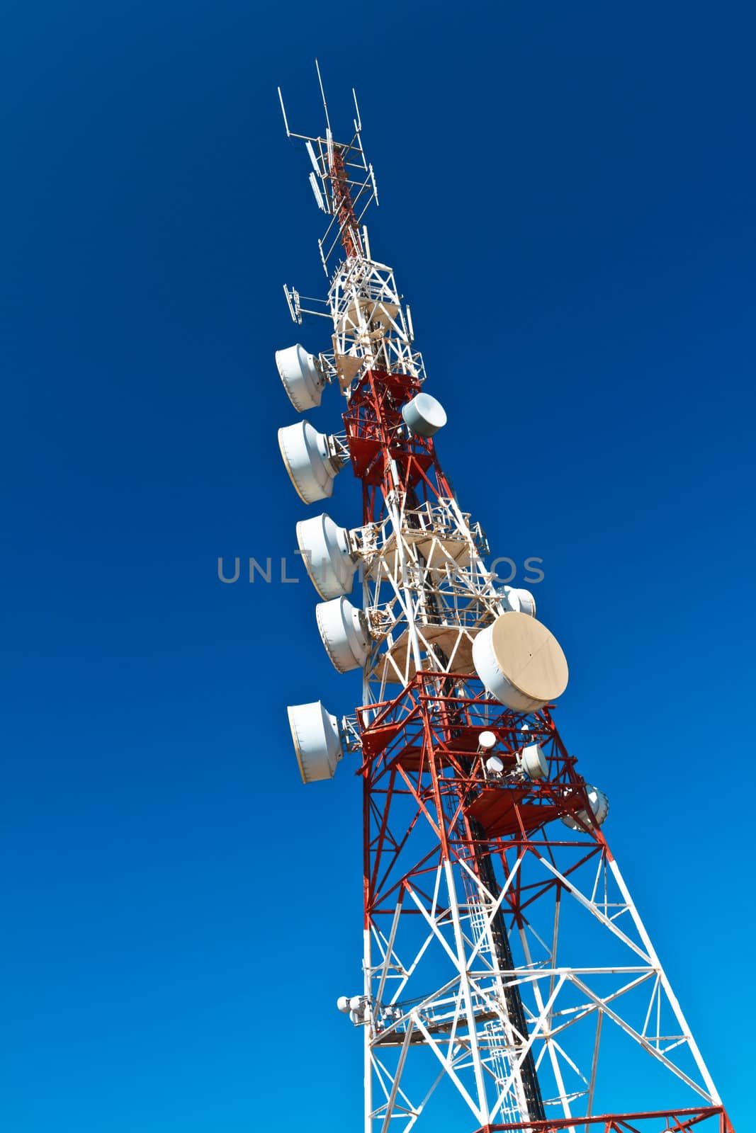 Communications tower with a beautiful blue sky