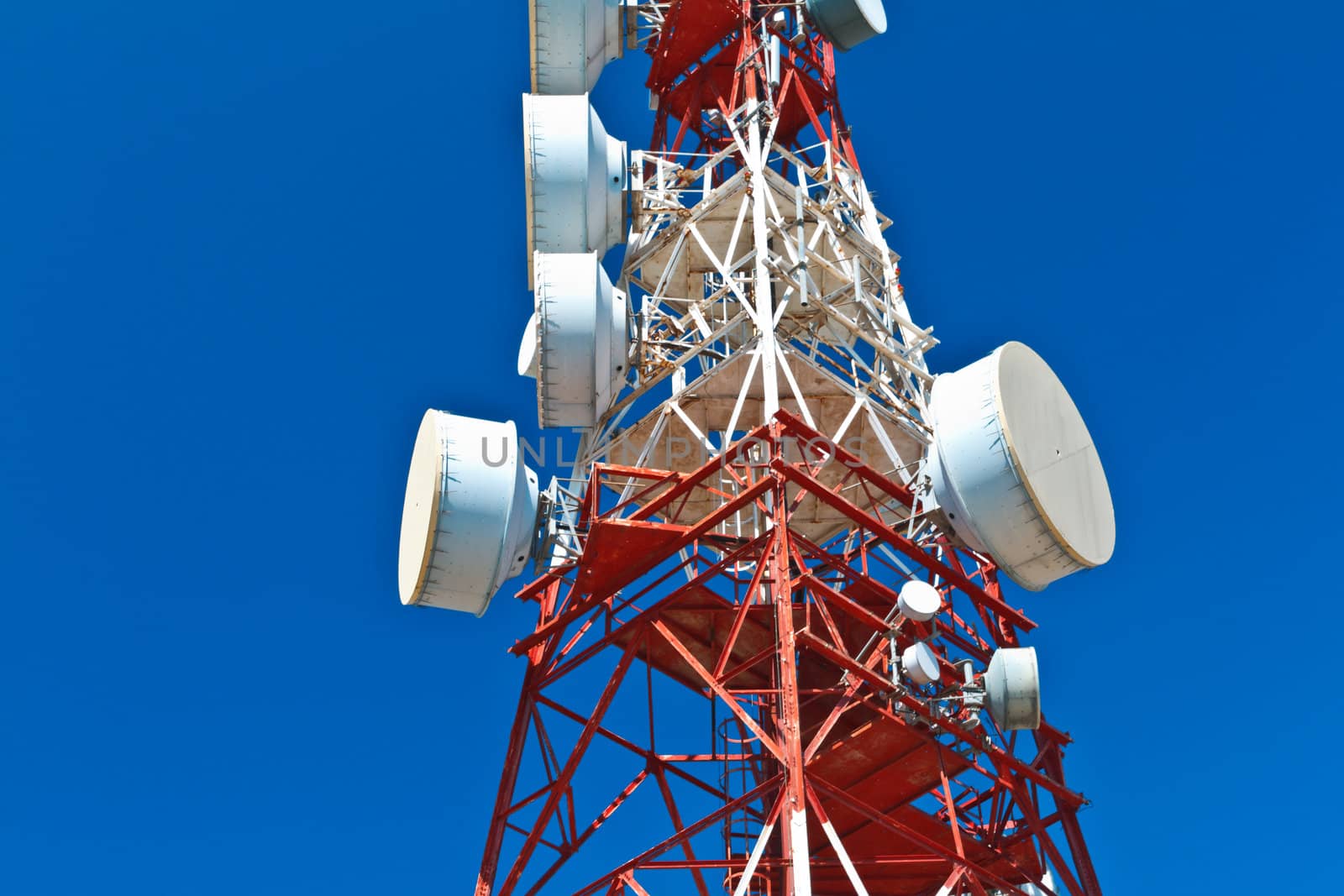 Communications tower with a beautiful blue sky