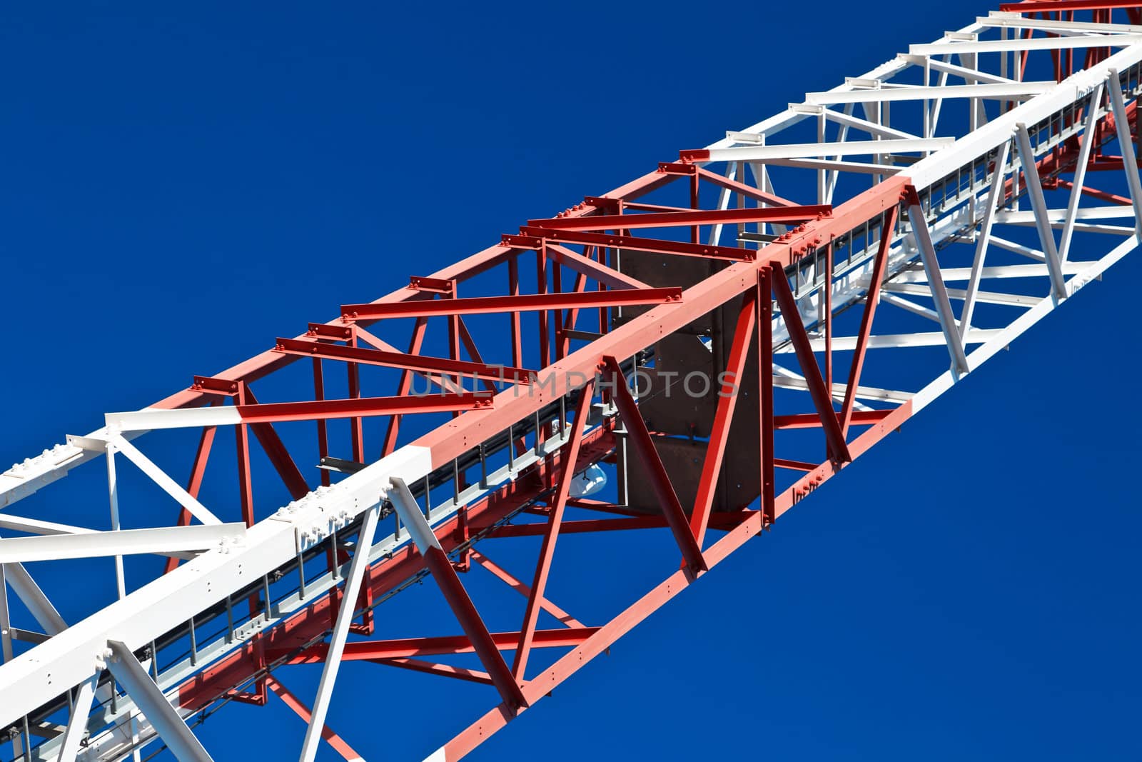 Detail of a communications tower with a beautiful blue sky