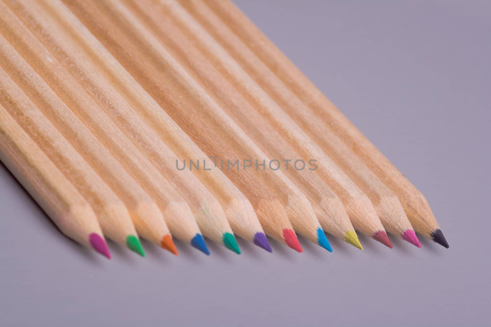 A composition of pencils of wood in a variety of colors
