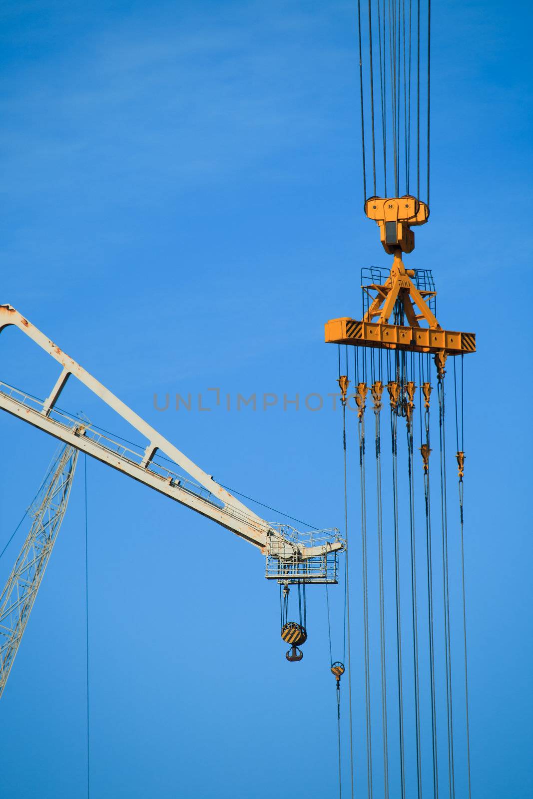 Cranes of the dockyards of Cadiz in a sunny day