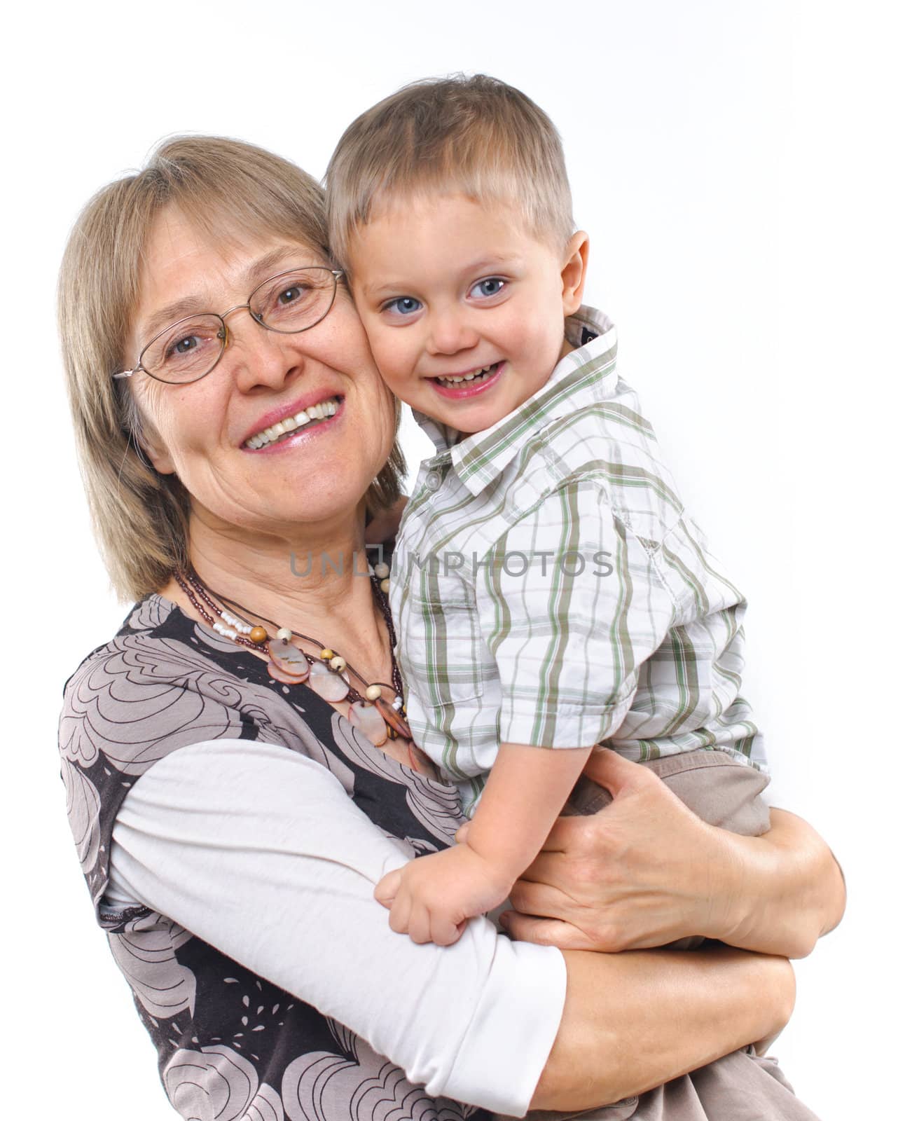 Happy grandmother with grandson in studio isolated