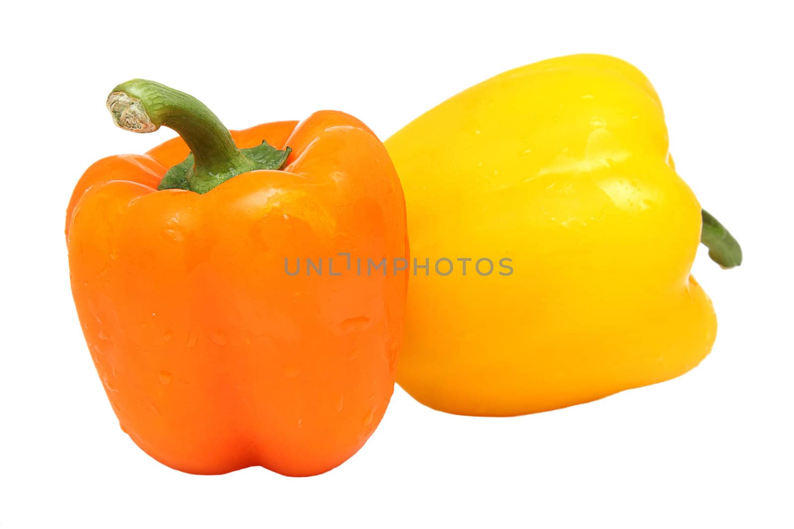 Two peppers, yellow and orange, isolated on white background