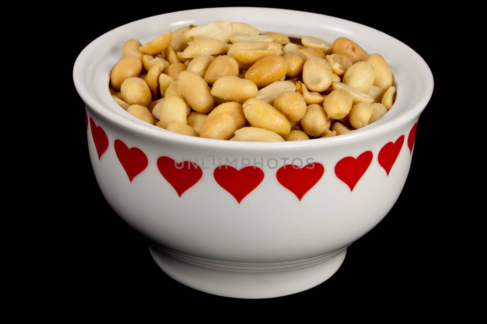 picture of a bunch of peanuts in a heart bowl