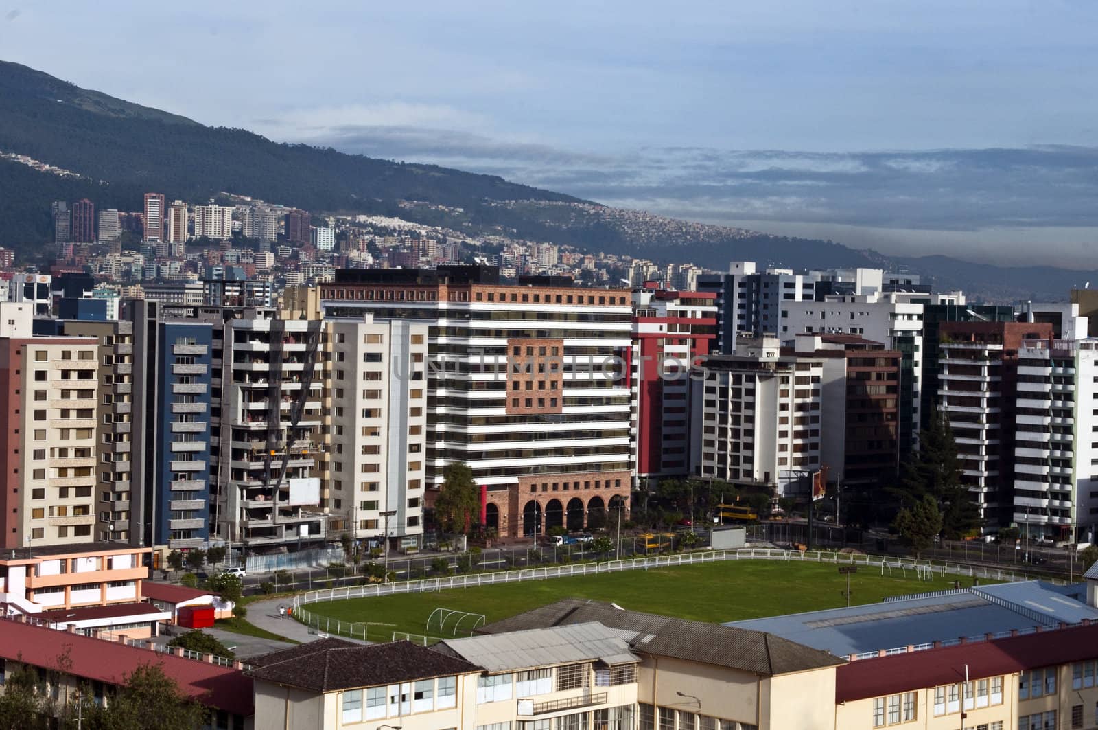 The modern city of Quito, with its skyscrapers and soccer field