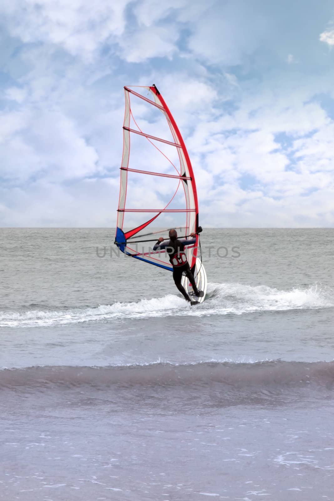 person windsurfing in the maharees in county kerry ireland during a storm