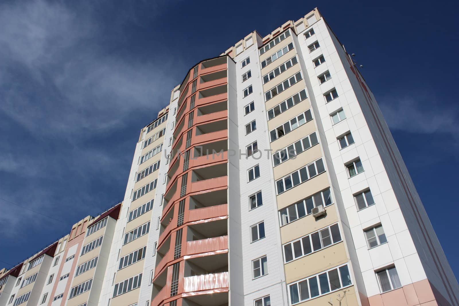 The inhabited high house against the blue sky
