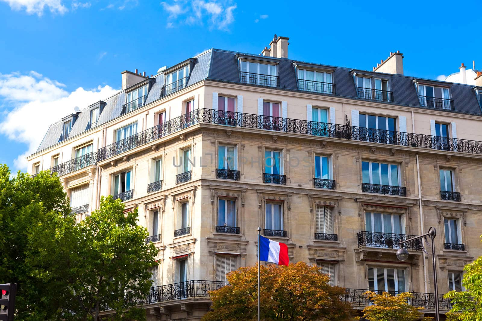 Typical house in Paris and the French flag