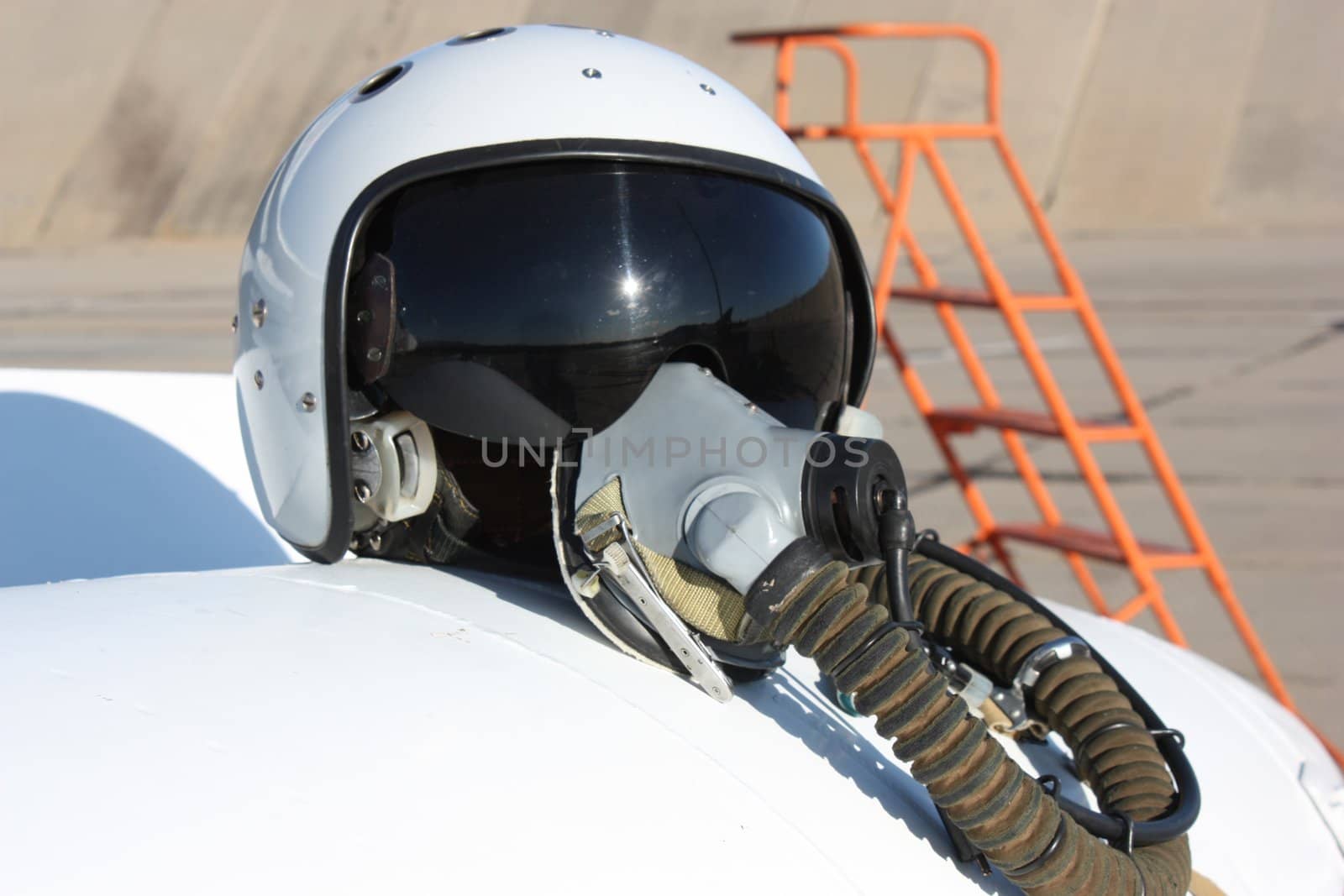 Protective helmet of the pilot against the plane with an oxygen mask on a fuel tank