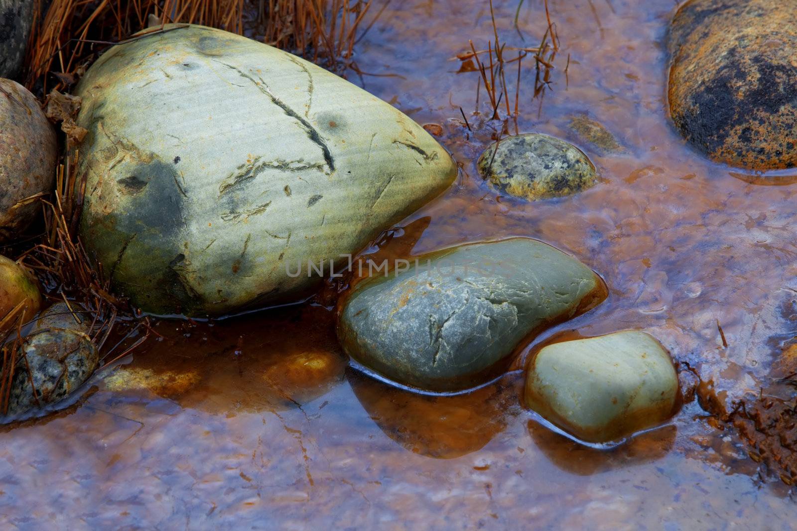 Colorful picture of straws and rocks at Moelen, Norway