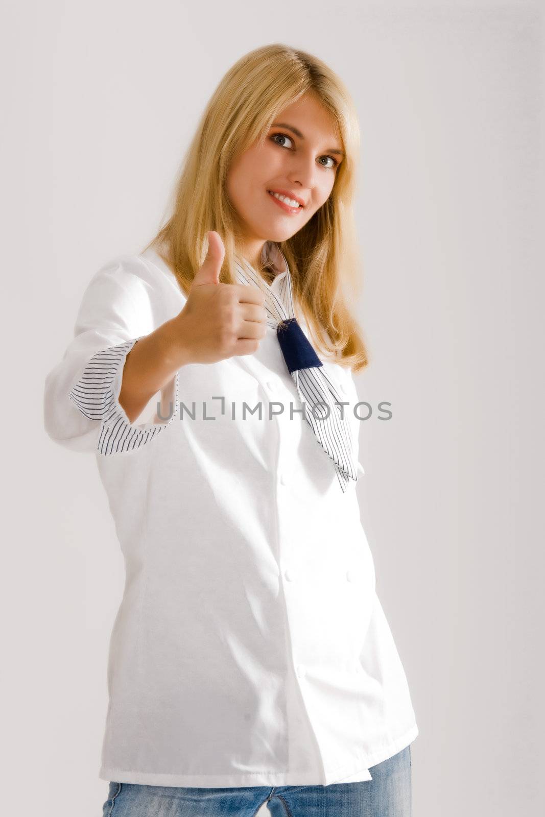 positive woman in work clothes with thumbs up