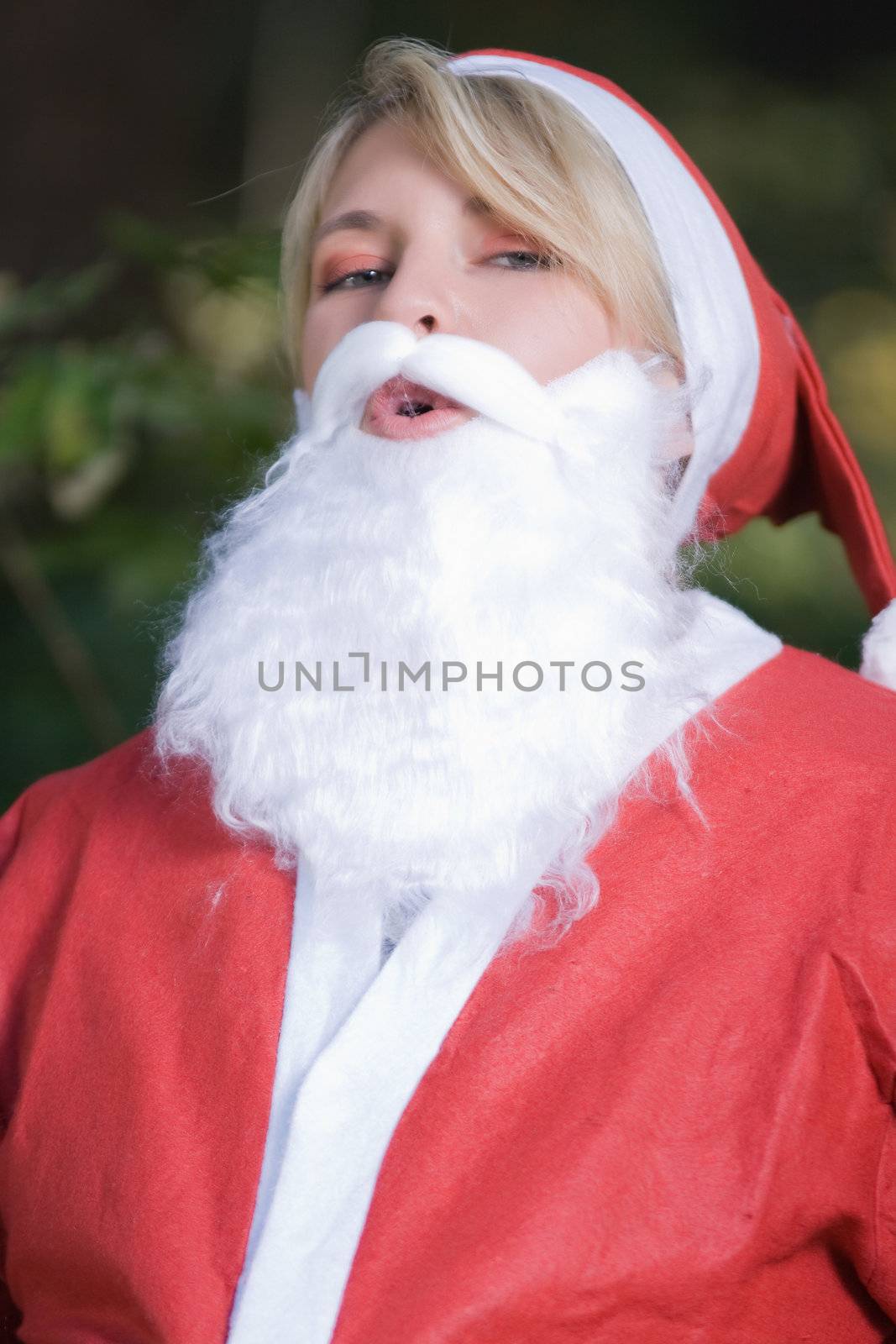 Portrait of a female Santa Claus with red jacket