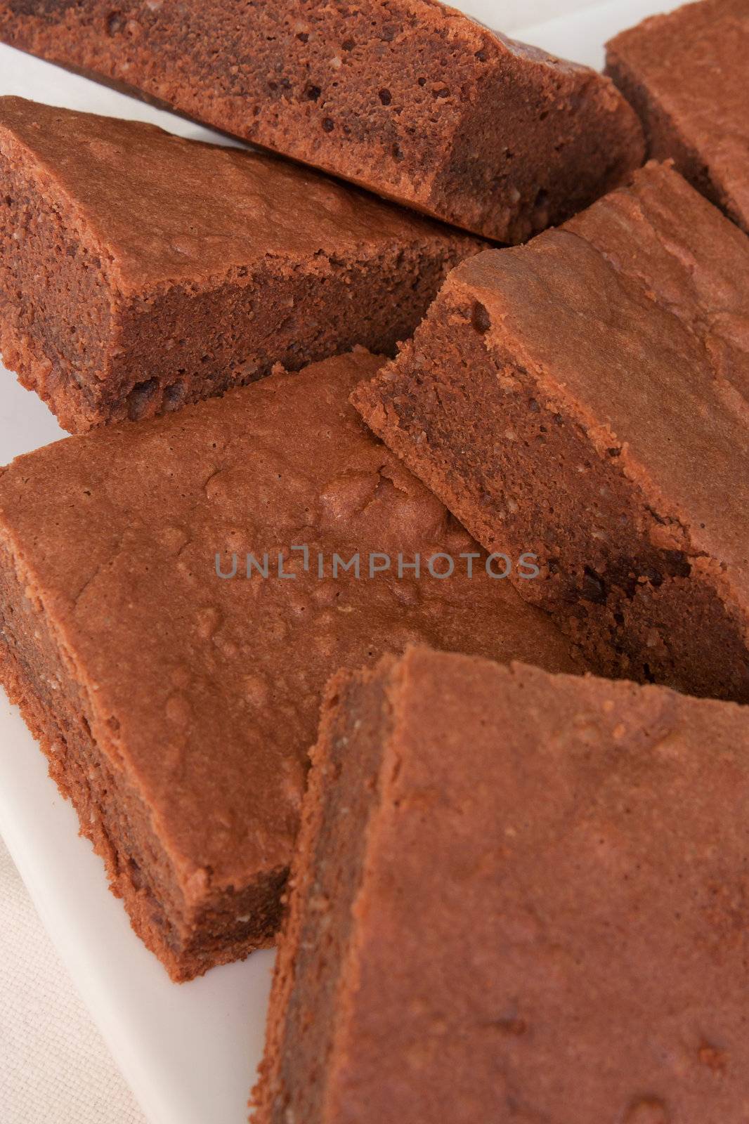 Pieces of chocolate cake on a white plate 